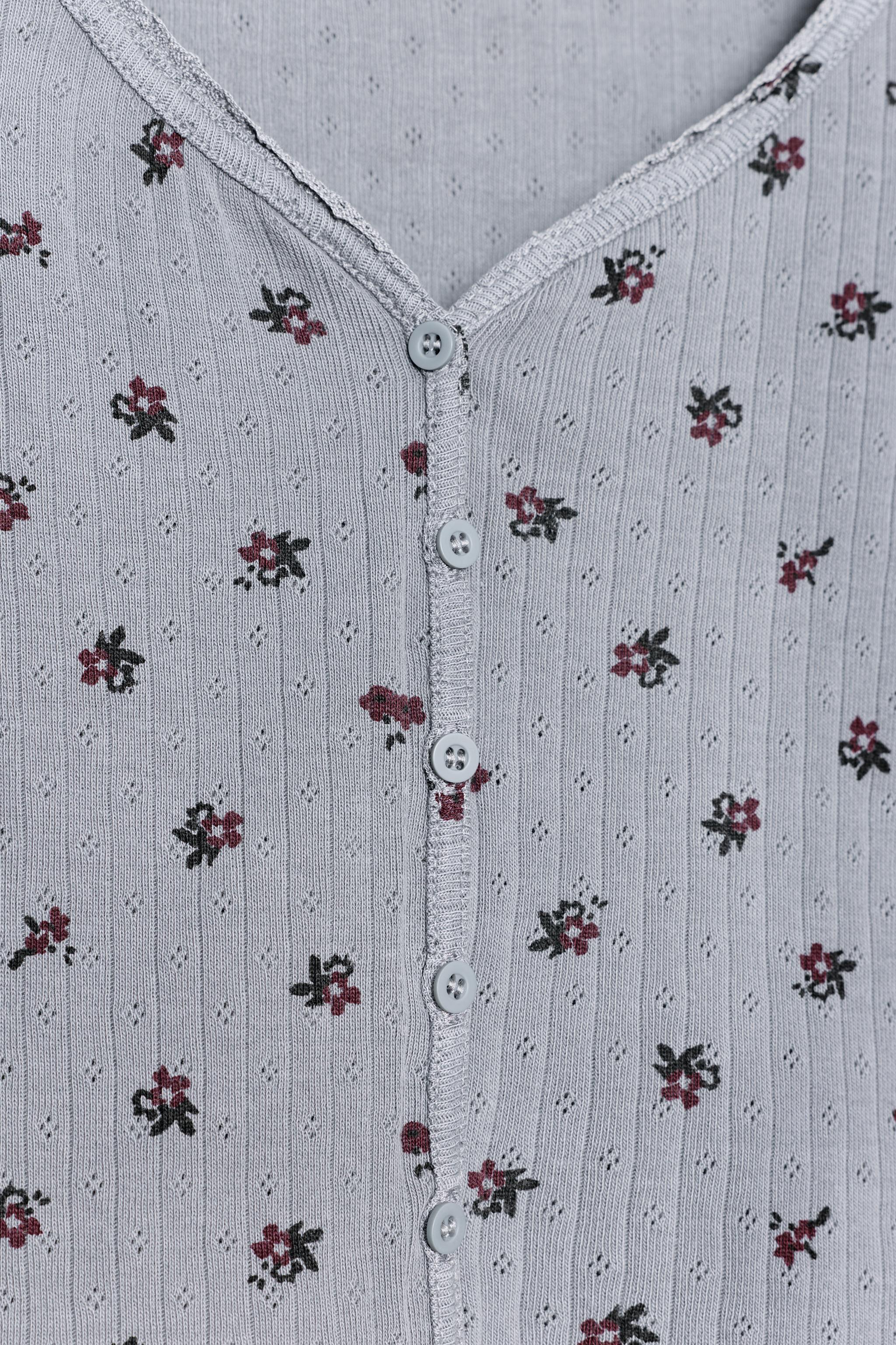 VESTE POINTELLE À FLEURS