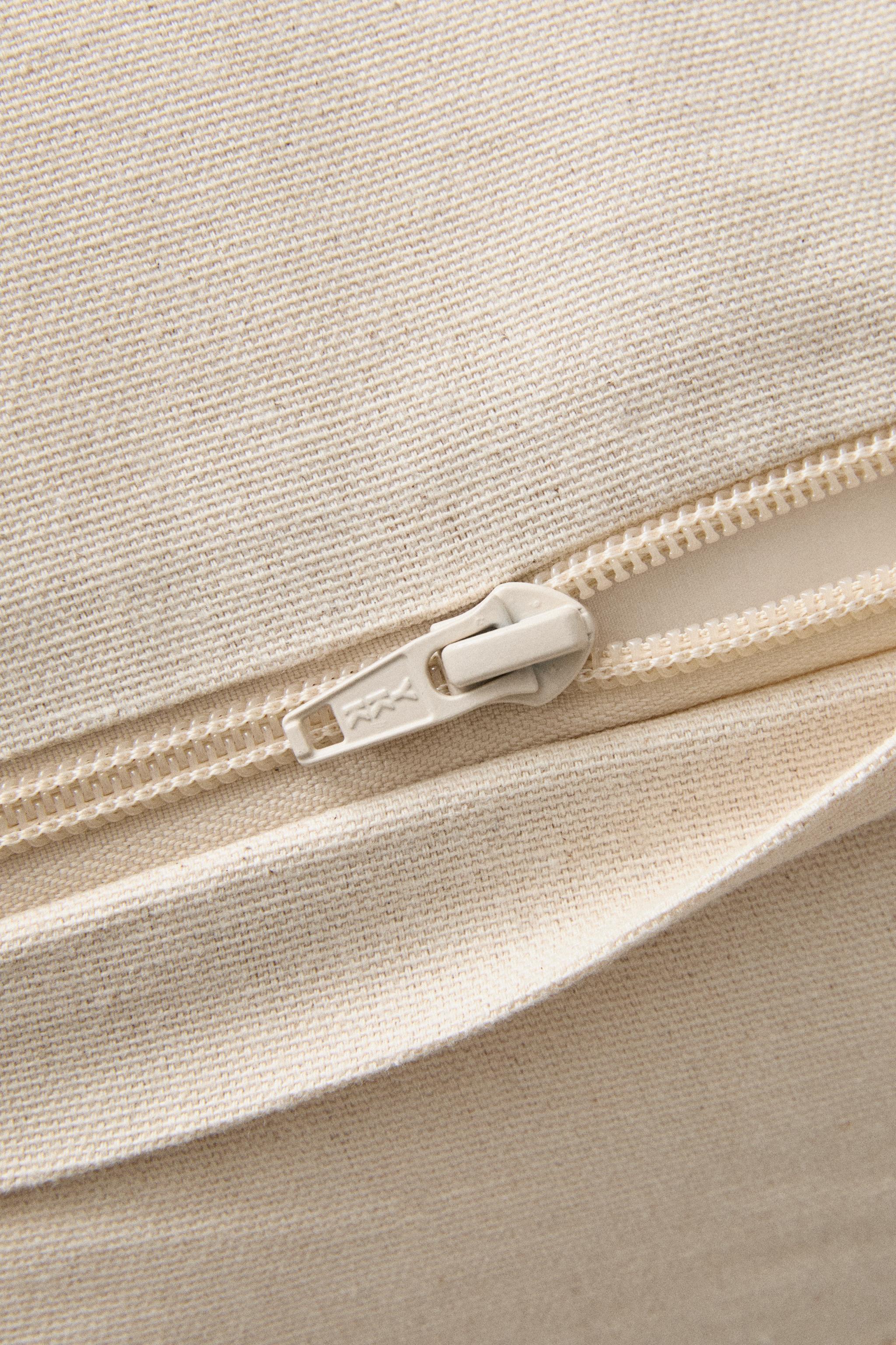HOUSSE DE COUSSIN TRESSÉE