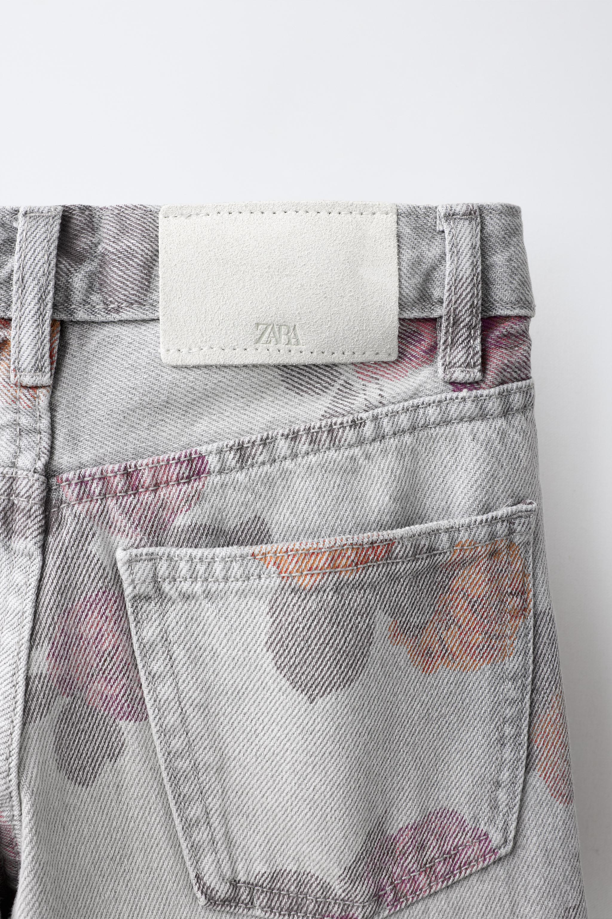 PANTALON À JAMBES LARGES IMPRIMÉ ROSES