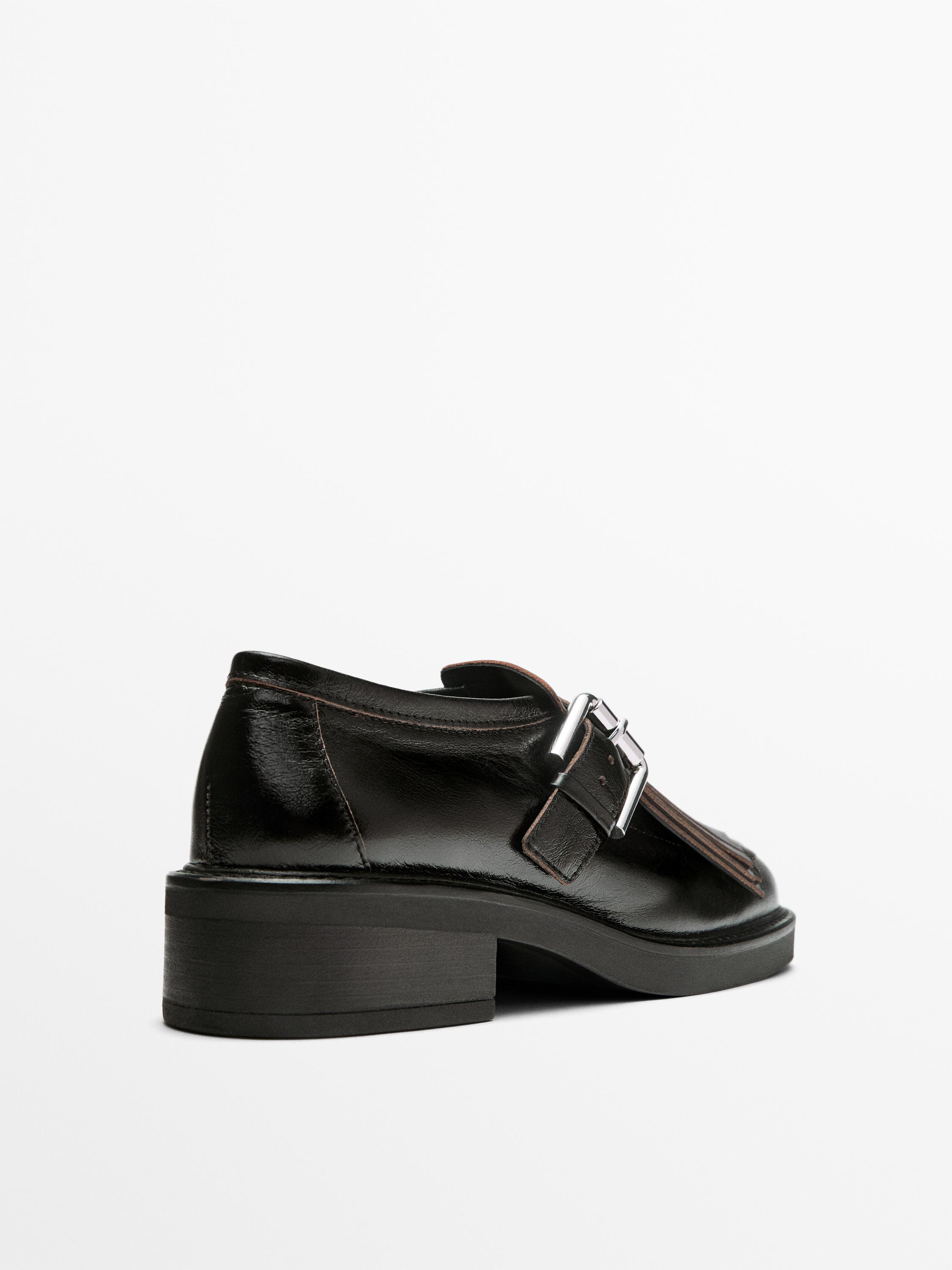 Buckled derby shoes with fringe