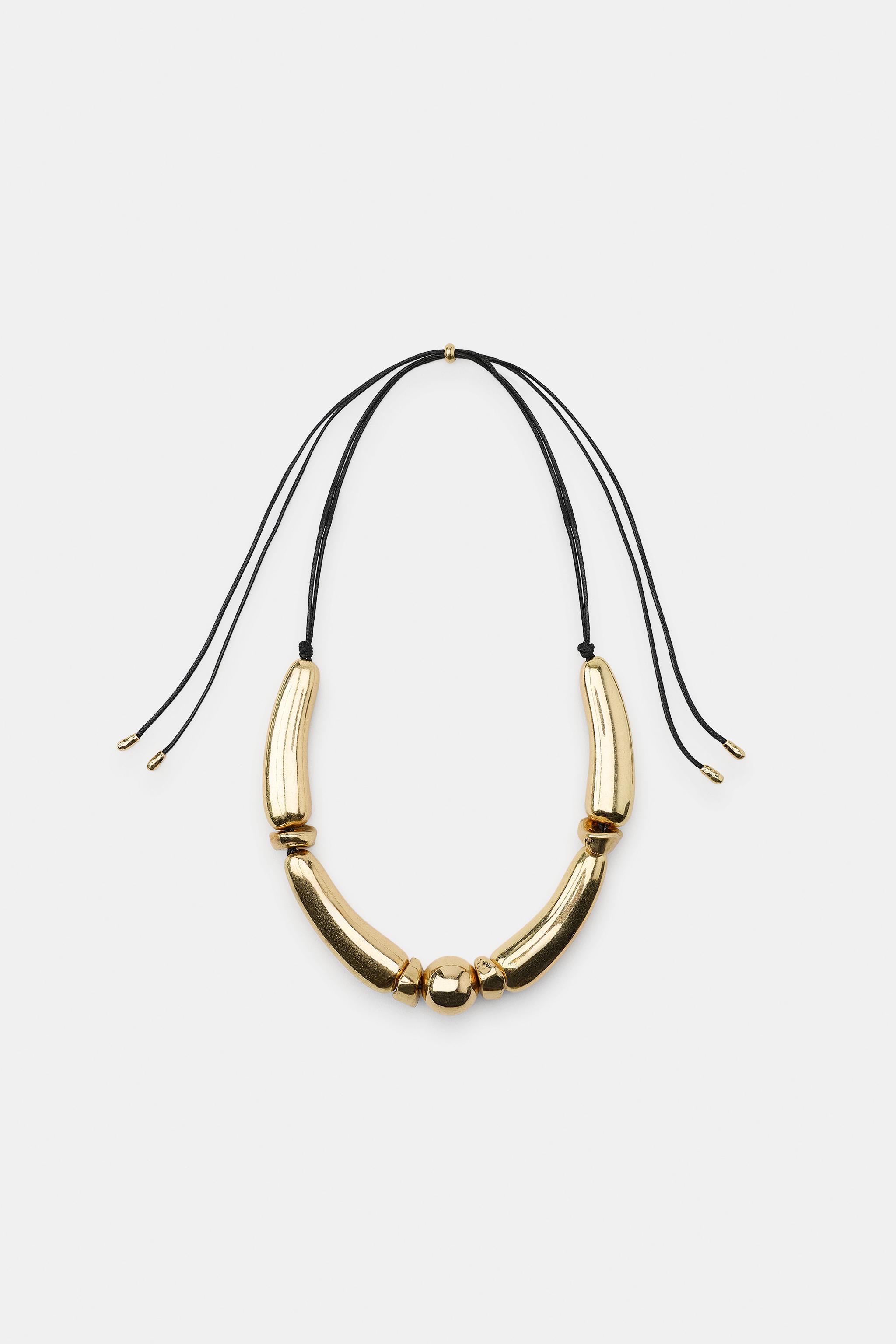METALLIC PIECES CORD NECKLACE — Golden
