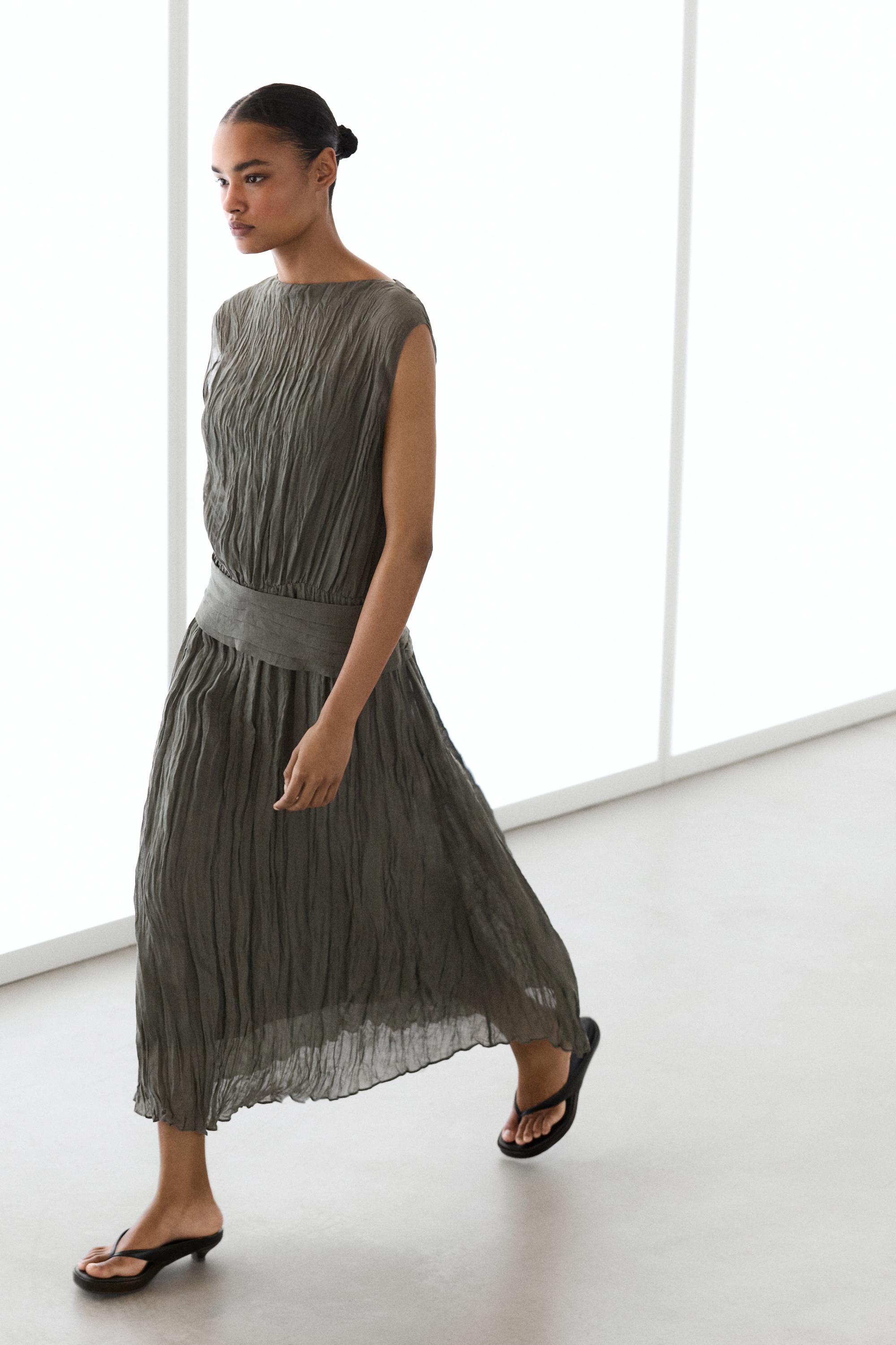 Textured flowing fabric dress with sash belt