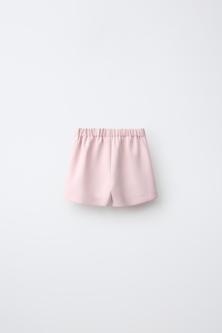 Pantalón corto con falda y cierre de botones 2