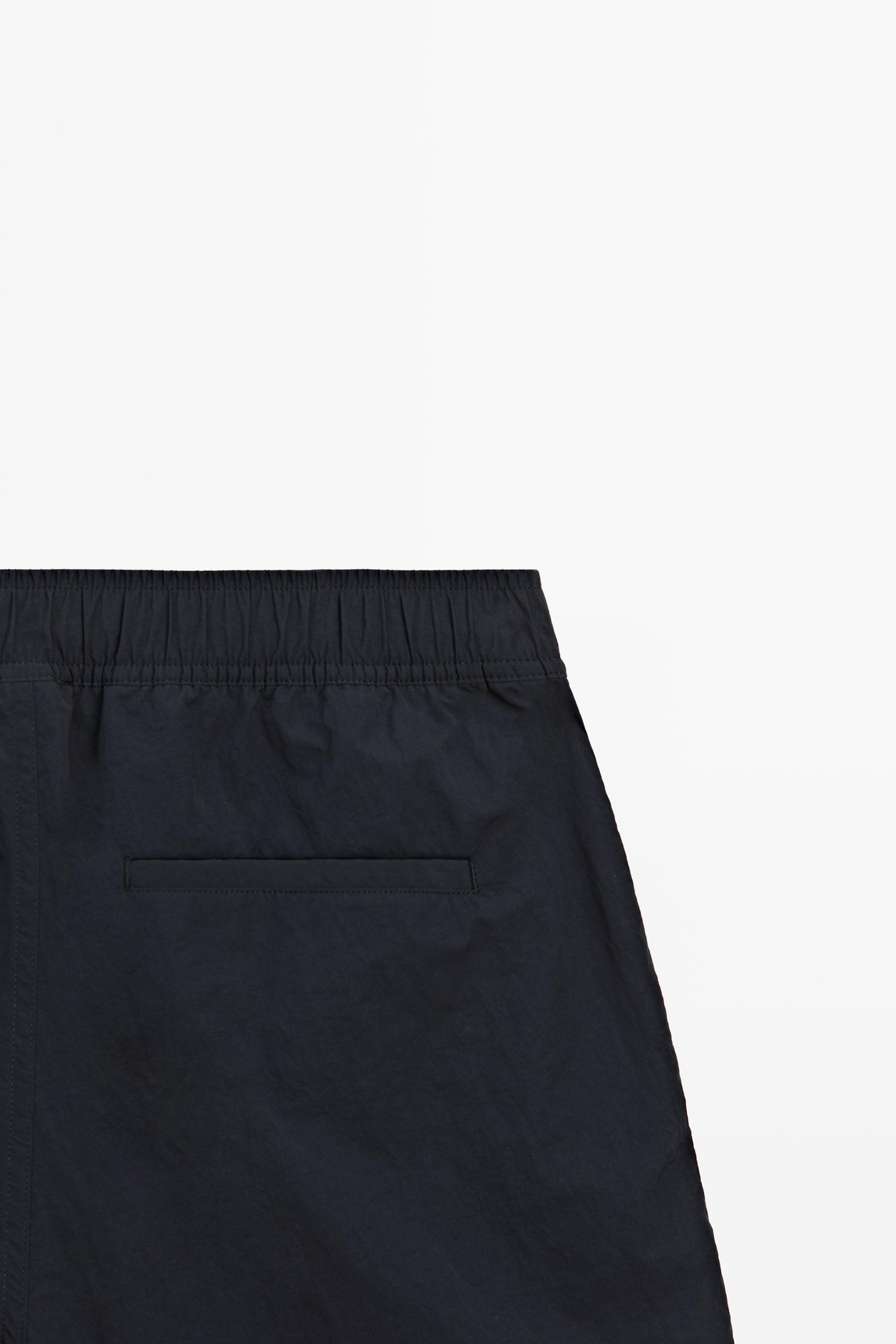 Plain swimming trunks with waist detail