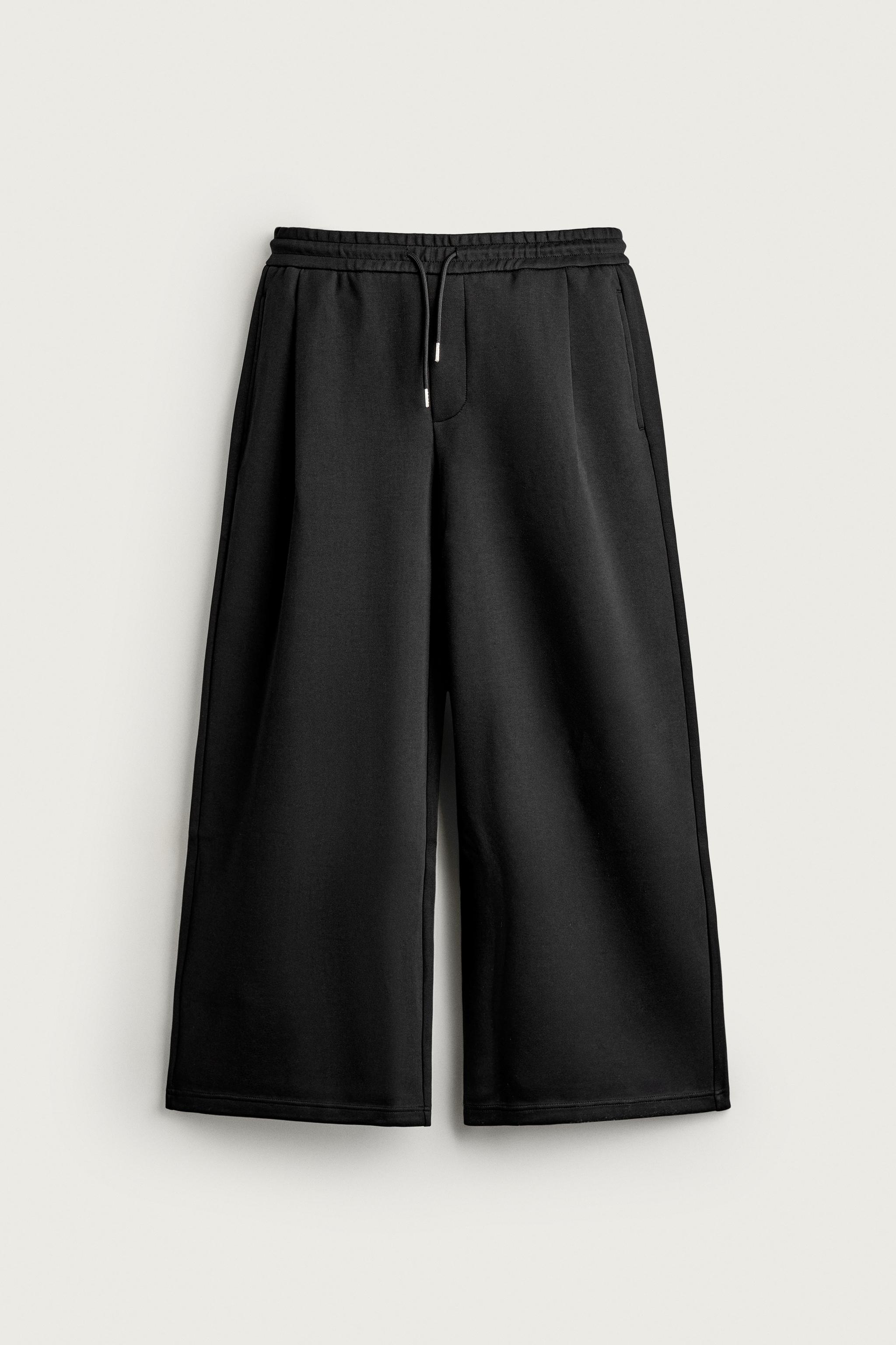 PLEATED BALLOON-FIT PANTS