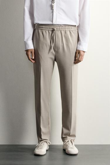 بنطلون بخصر JOGGER سهل العناية - محمِر فاتح الخاص بـ Zara