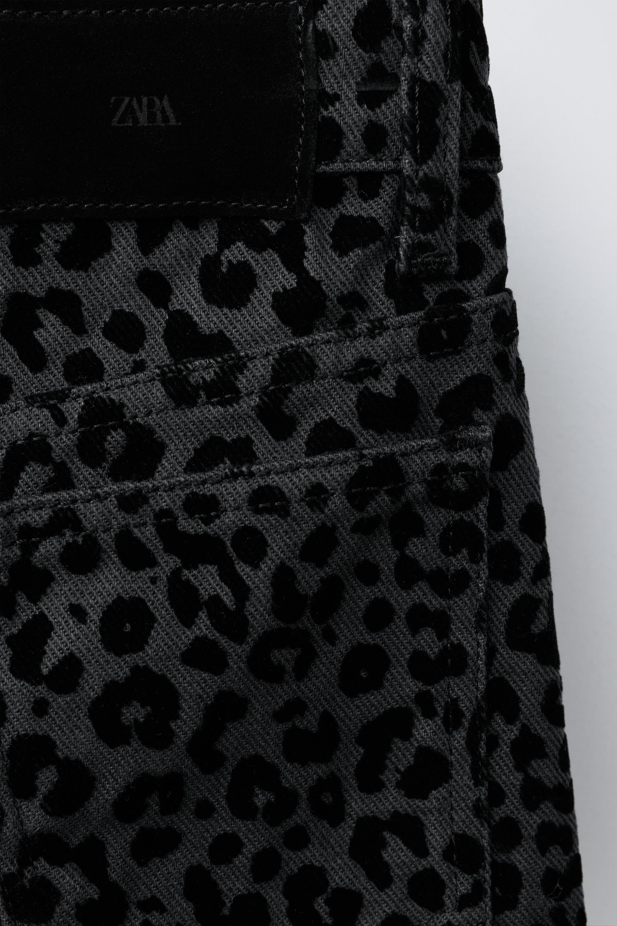 FLOCKED ANIMAL PRINT WIDE LEG JEANS