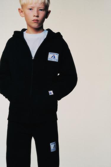 JOGGING TROUSERS WITH LABEL - Black by Zara