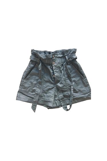 HIGHWAISTED FAUX LEATHER PAPERBAG SHORTS FEATURING A BUTTON FLY AND A MATCHING TIE BELT.