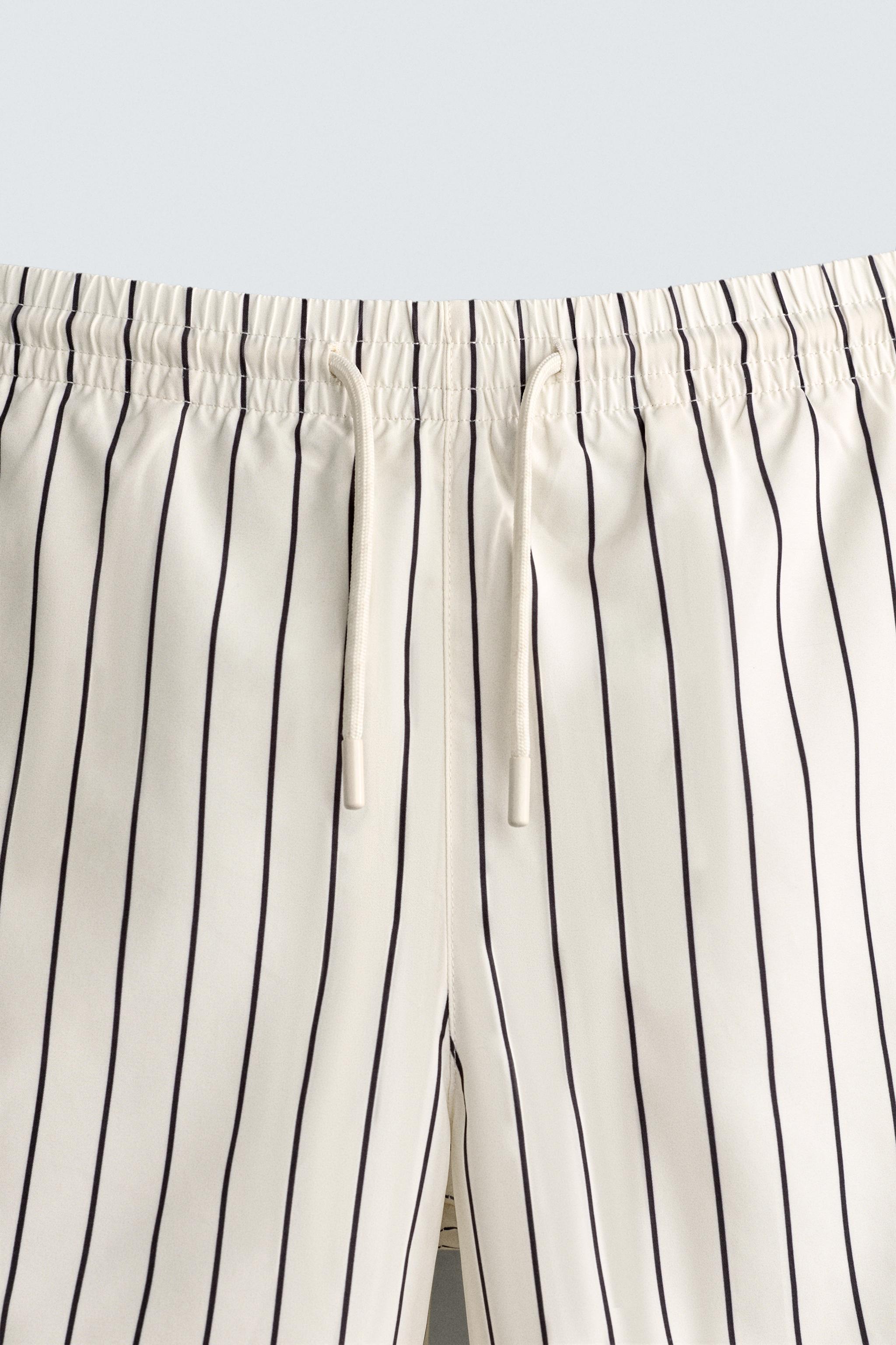 STRIPED MID-LENGTH SWIM TRUNKS