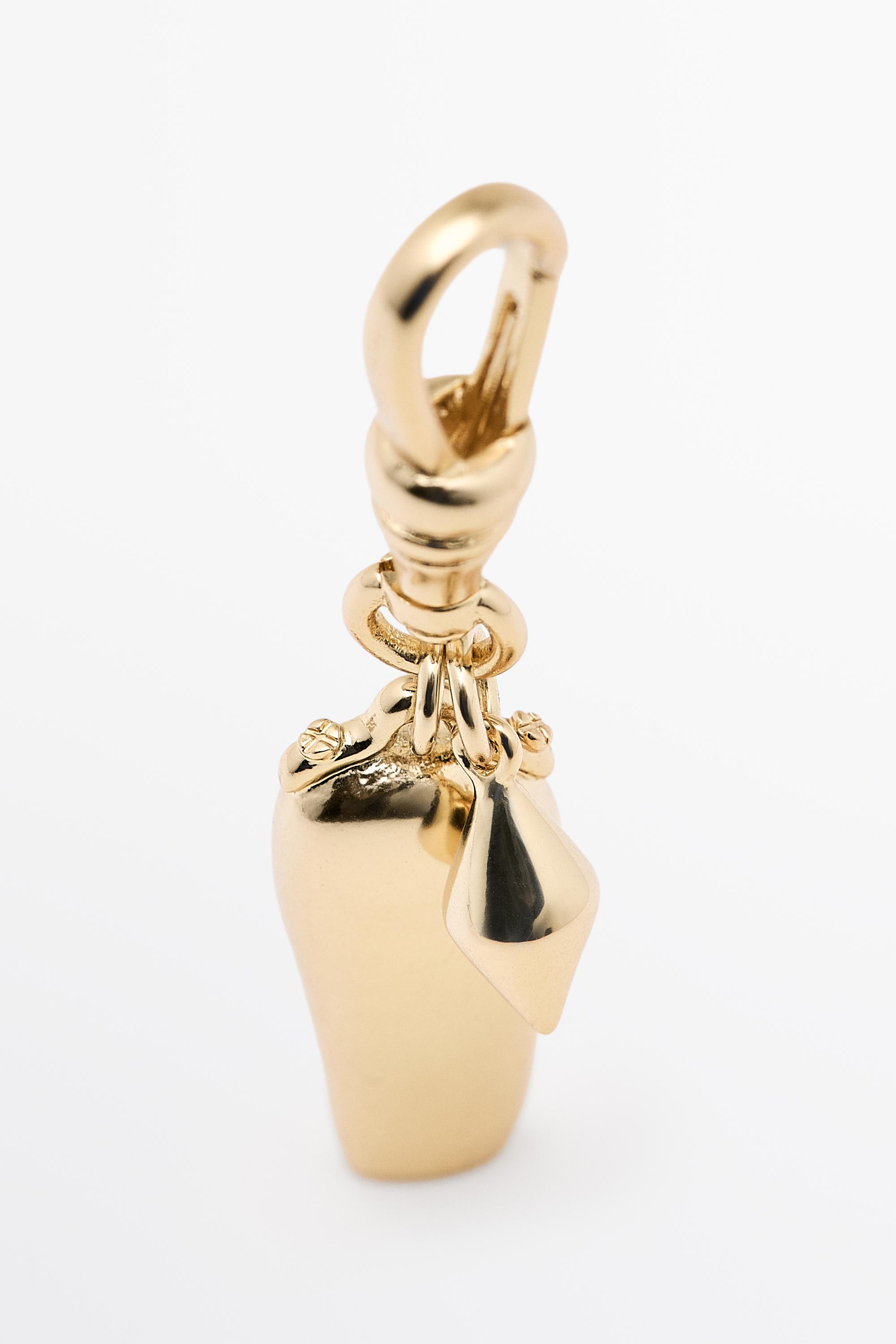 Elongated charm pendant — Golden