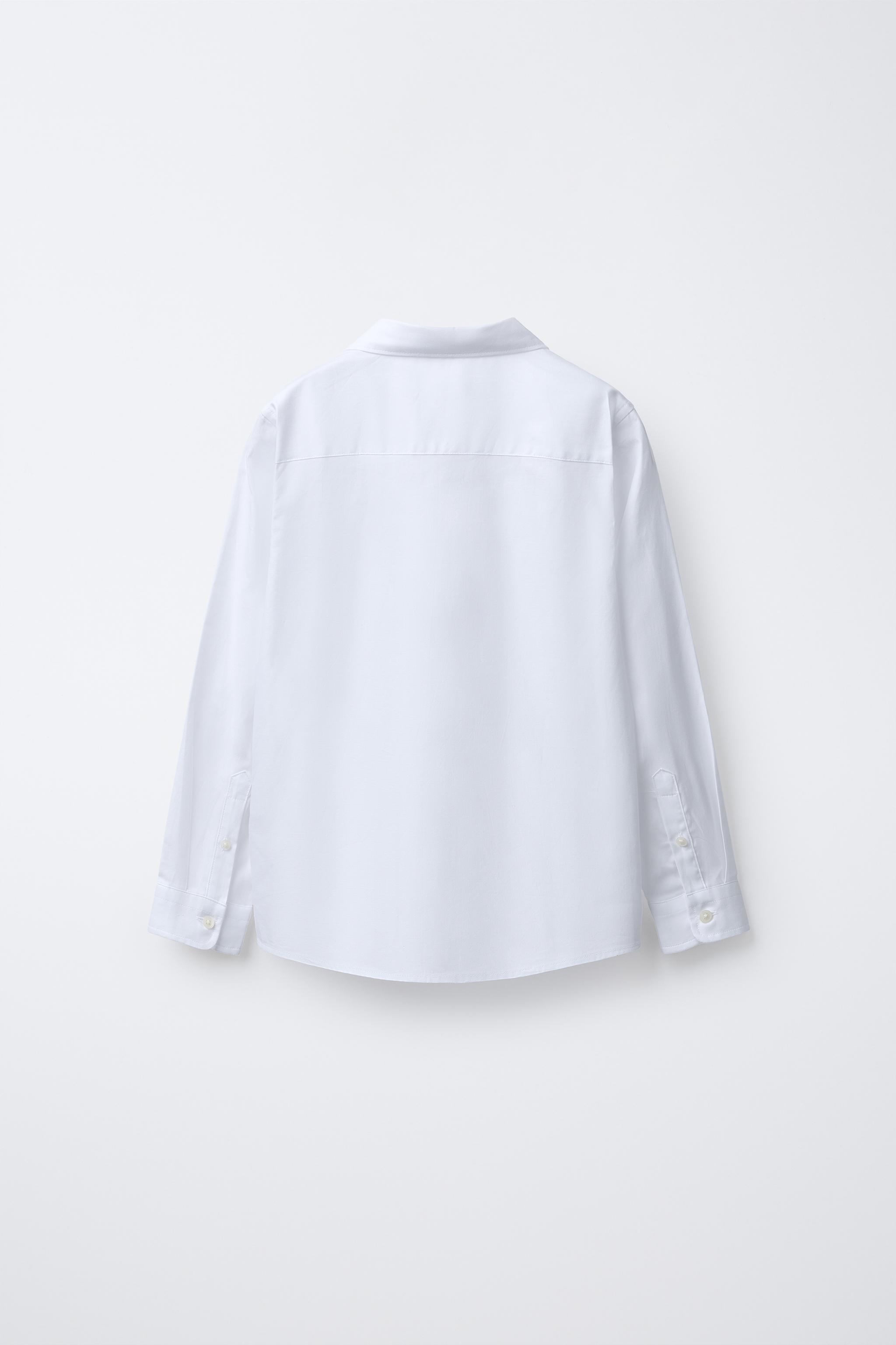 CHEMISE UNIE HABILLÉE