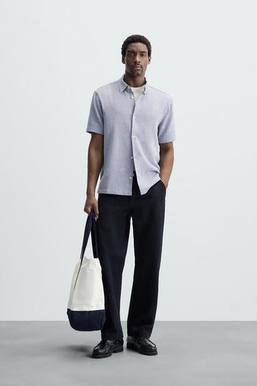 Zara Relaxed fit shirt made of cotton blend fabric. Lapel collar and short sleeves. Side vents at hem. Front button closure. - Sky blue - Image 0