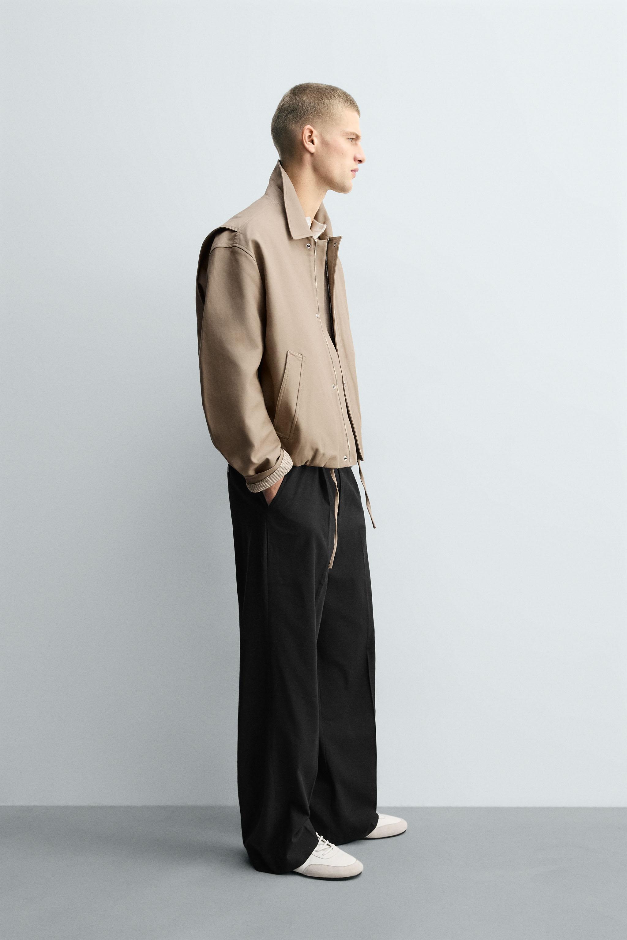 TEXTURED PLEATED PANTS