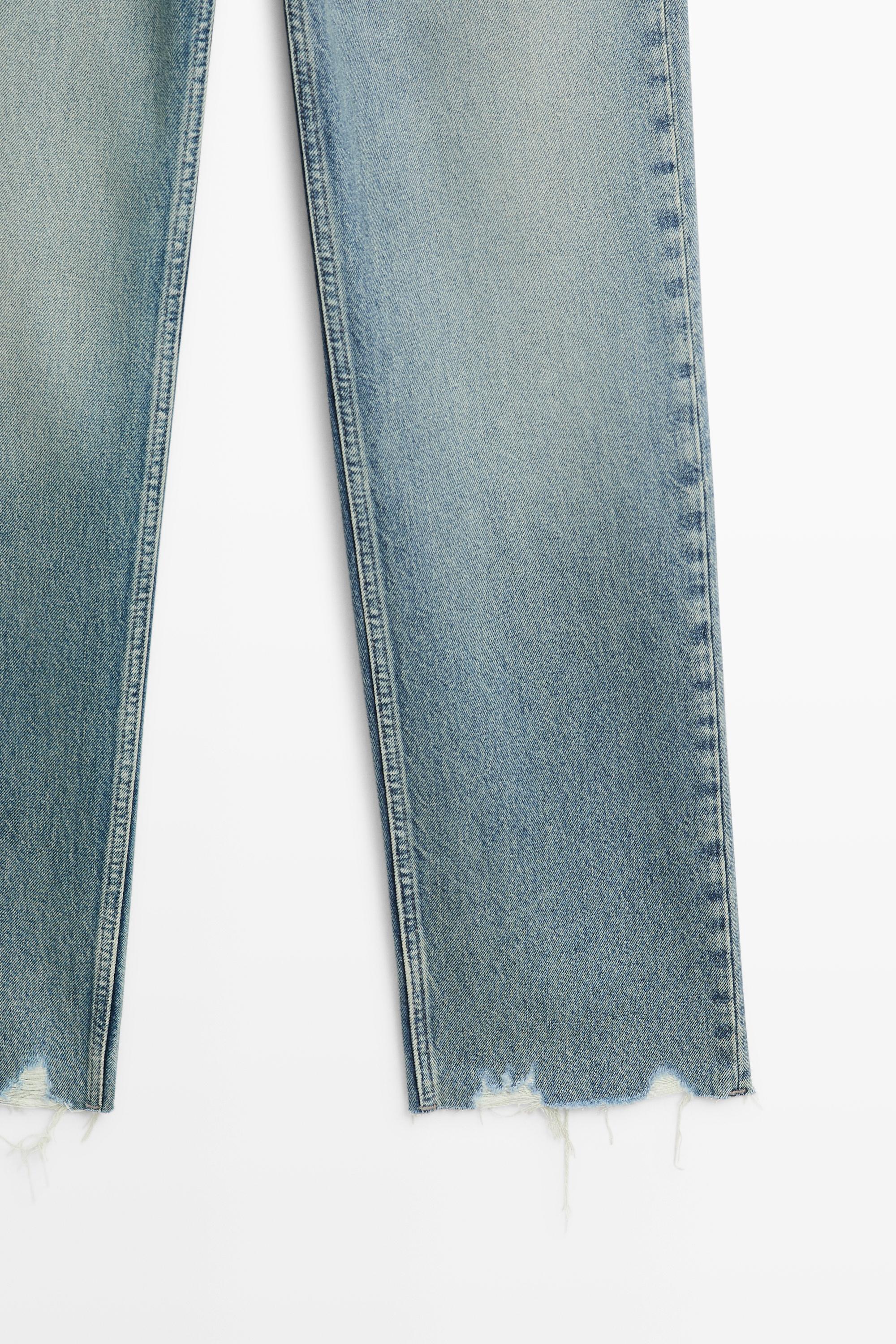 Mid-waist stovepipe jeans with frayed hems