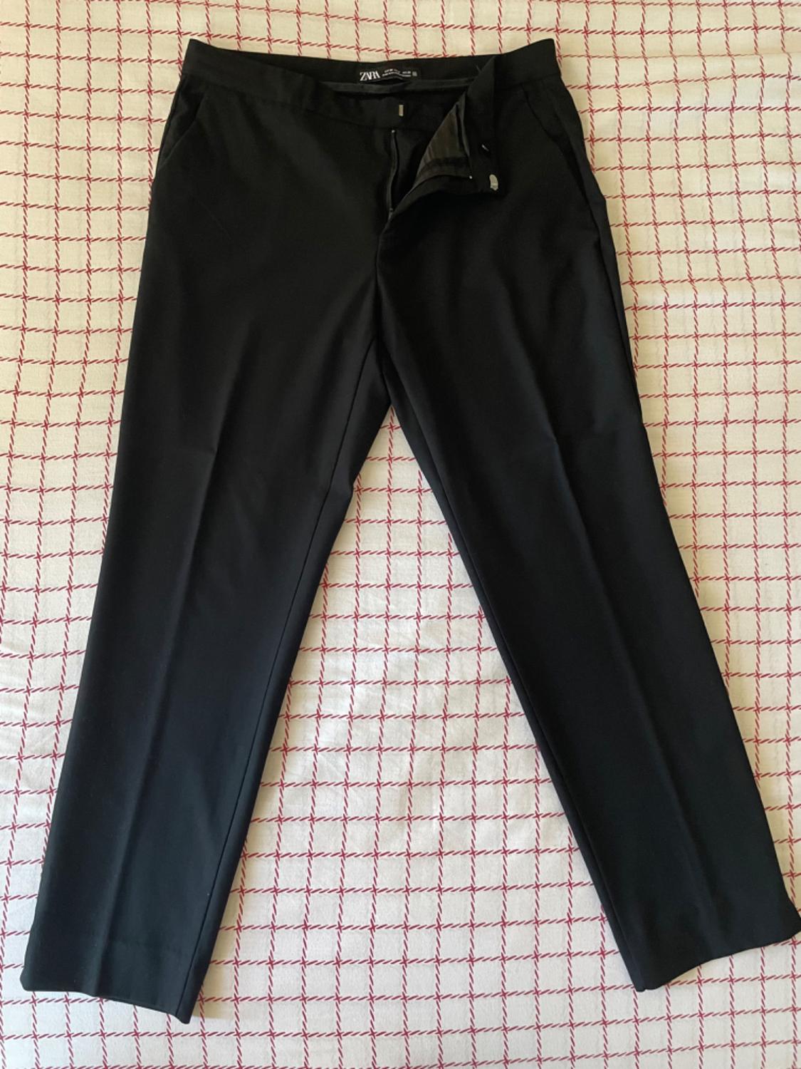 SUIT TROUSERS WITH VENT ON THE HEM