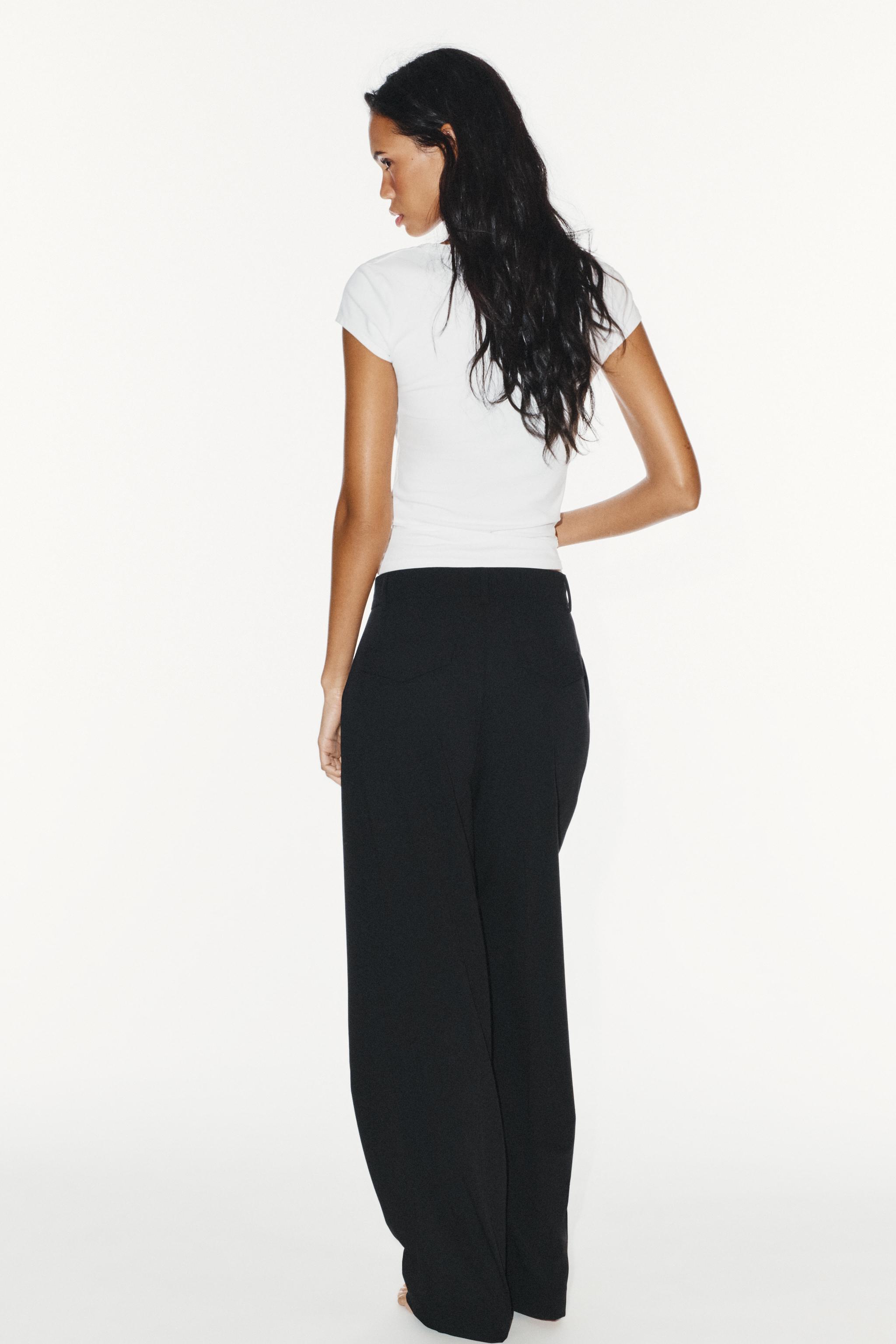 STRIPED PLEATED PANTS WITH FLAP POCKETS