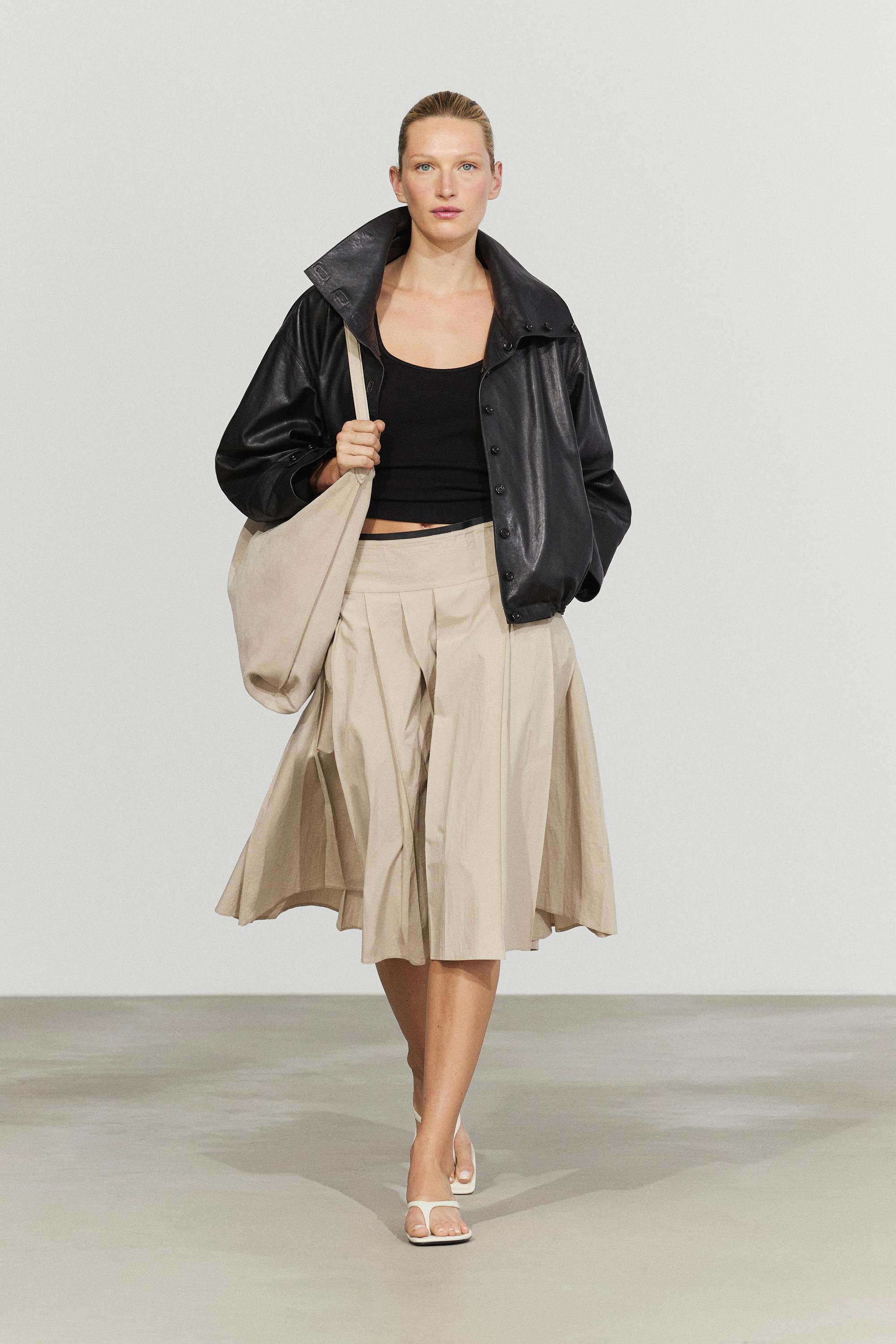 Pleated midi skirt with contrasting sash
