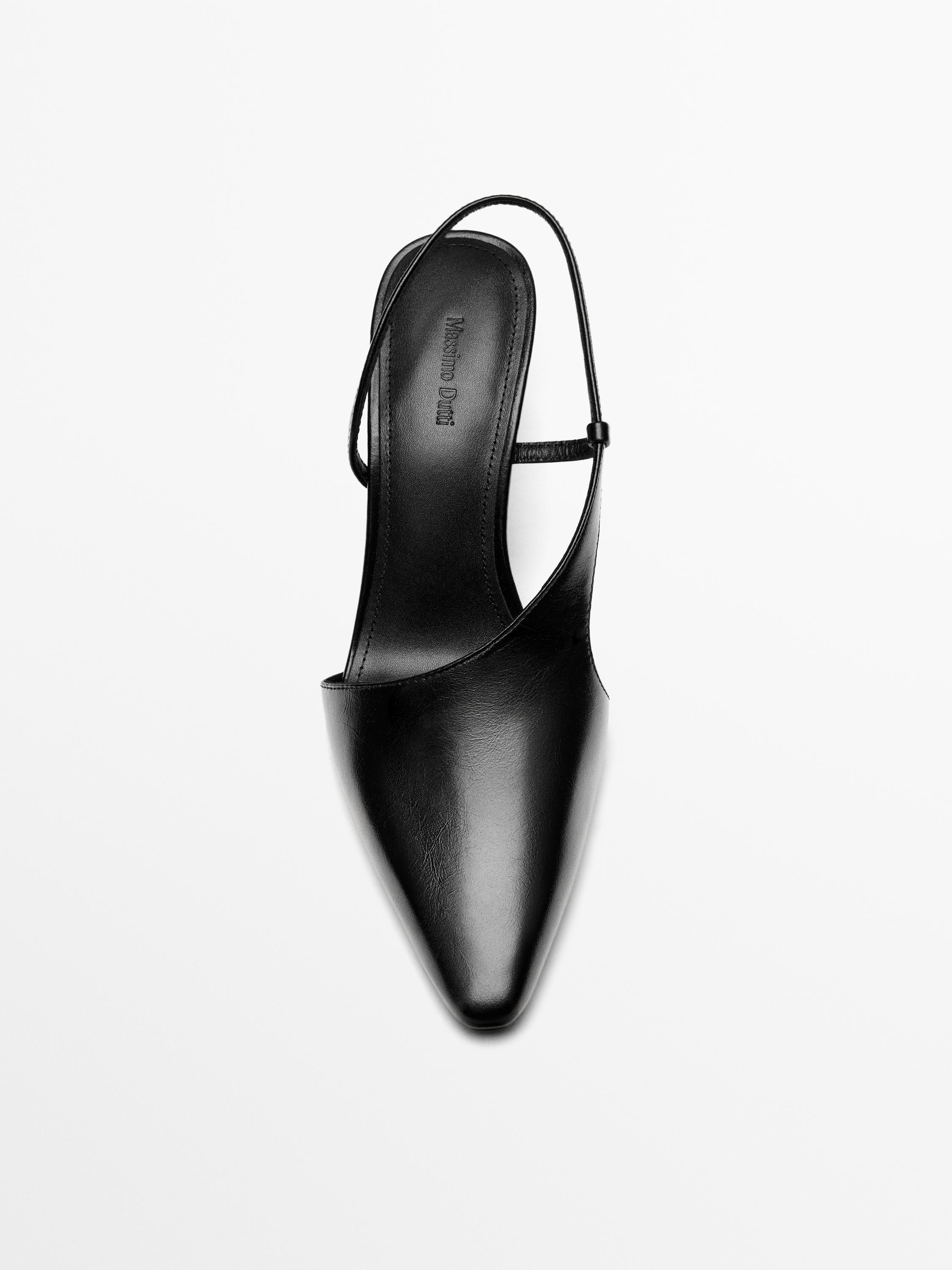Asymmetric high-heel shoes