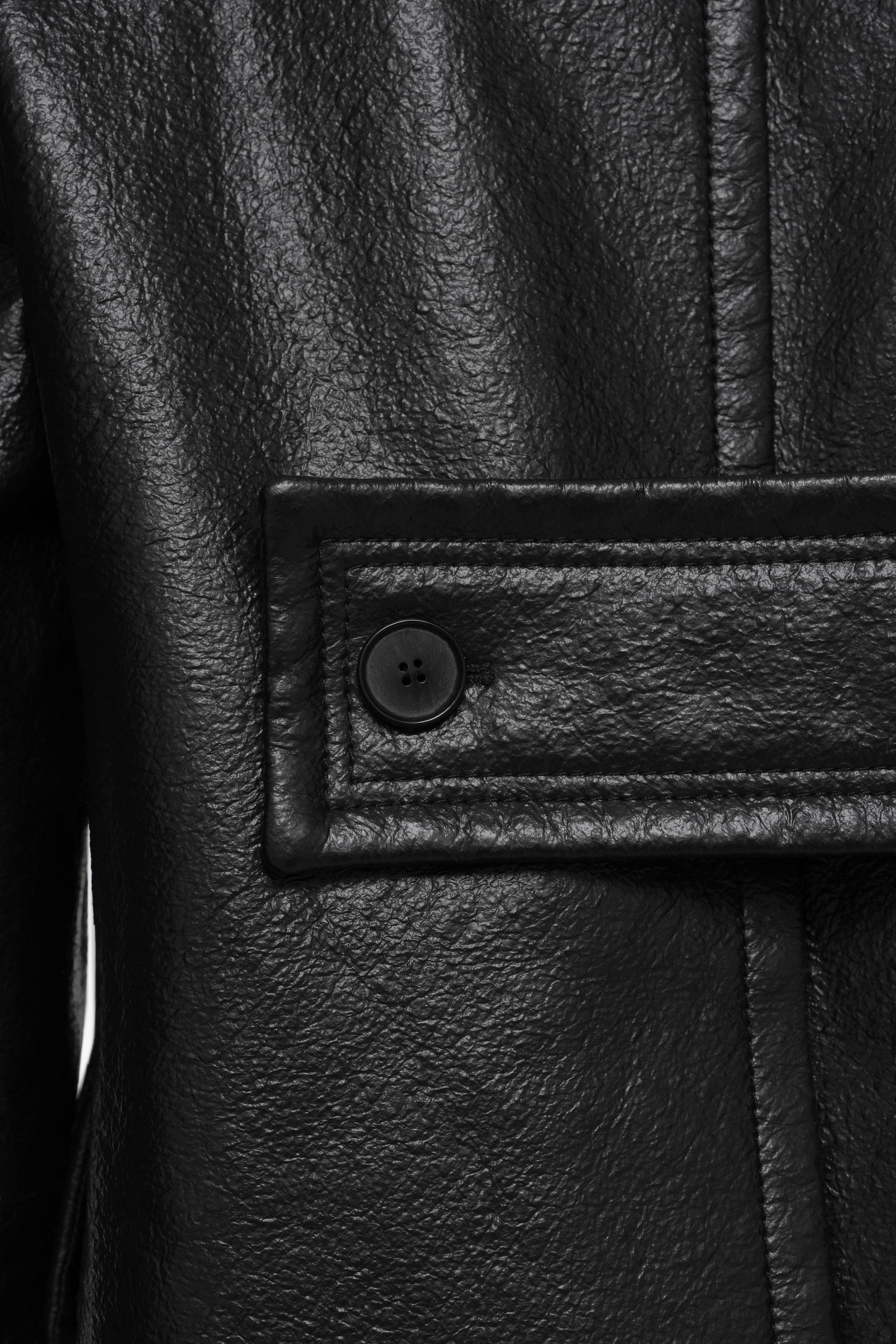 LIMITED EDITION ASYMMETRIC LEATHER EFFECT COAT