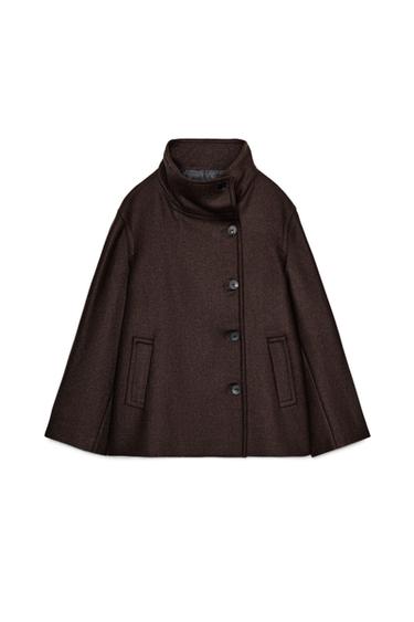Front view of a short brown coat with a stand-up collar, long sleeves, jetted front pockets, and a double-breasted button fastening.