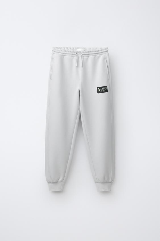 PANTALÓN SPORTY ESTAMPADO LOGO - Perla vigoré de Zara - Imagen 0