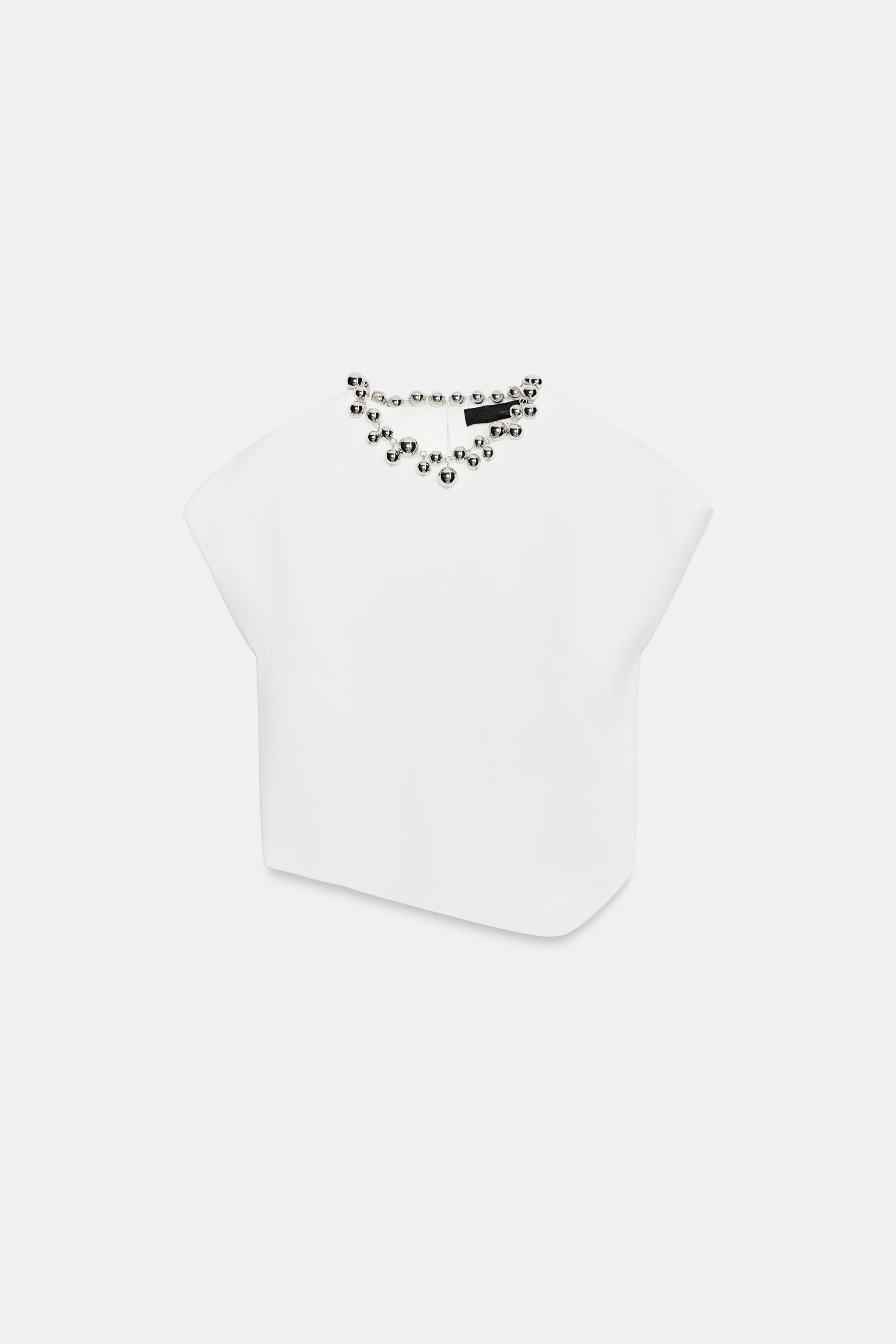 TOP EN MAILLE À BOULES AU COL