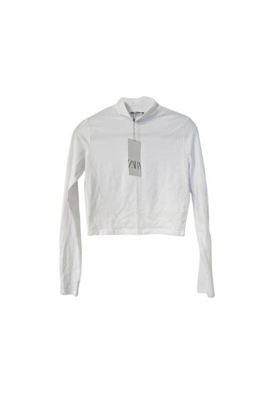 Front view of a white long-sleeved turtleneck t-shirt with a 'Zara' label.