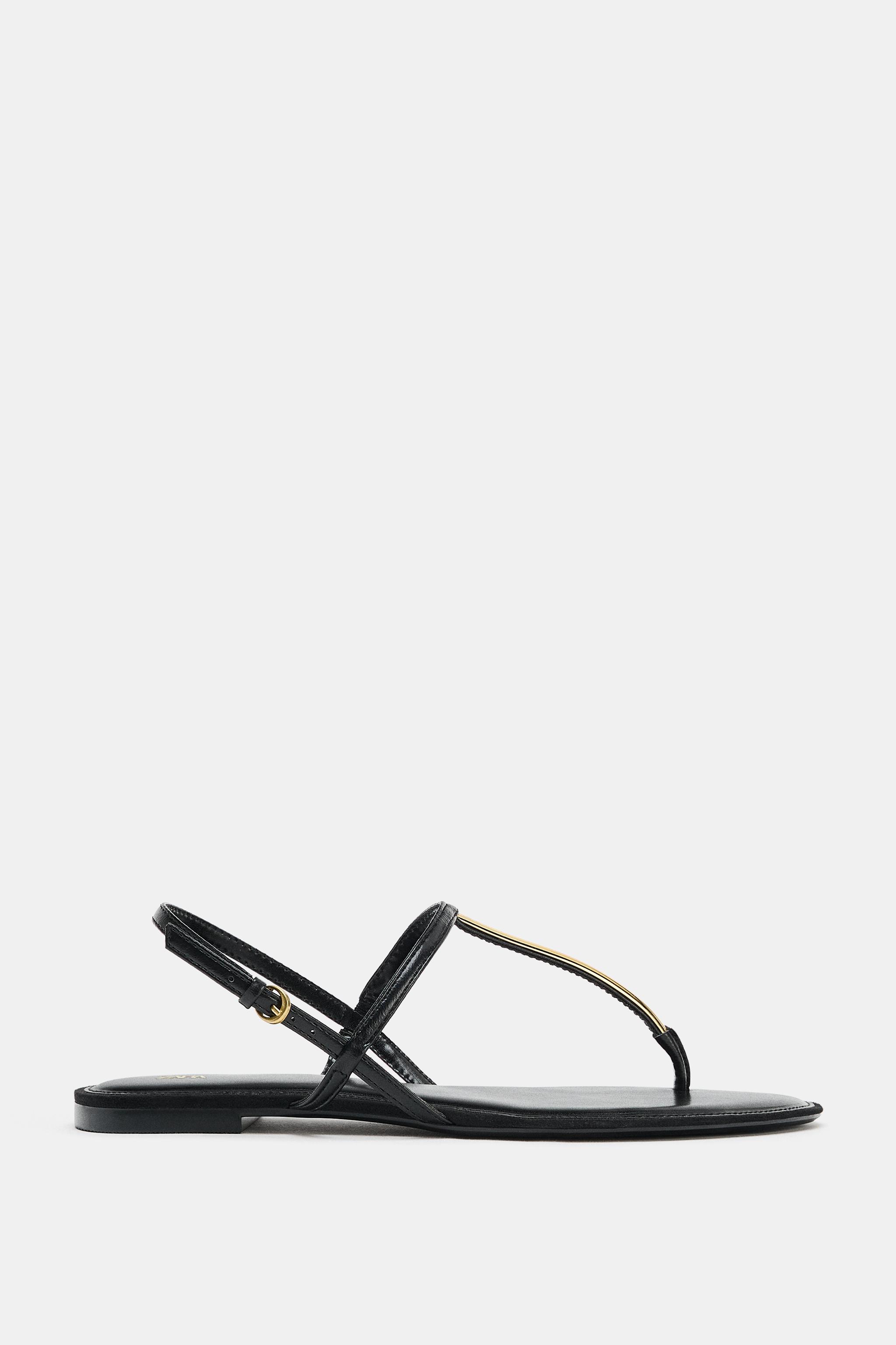 FLAT SANDALS WITH METALLIC APPLIQUE