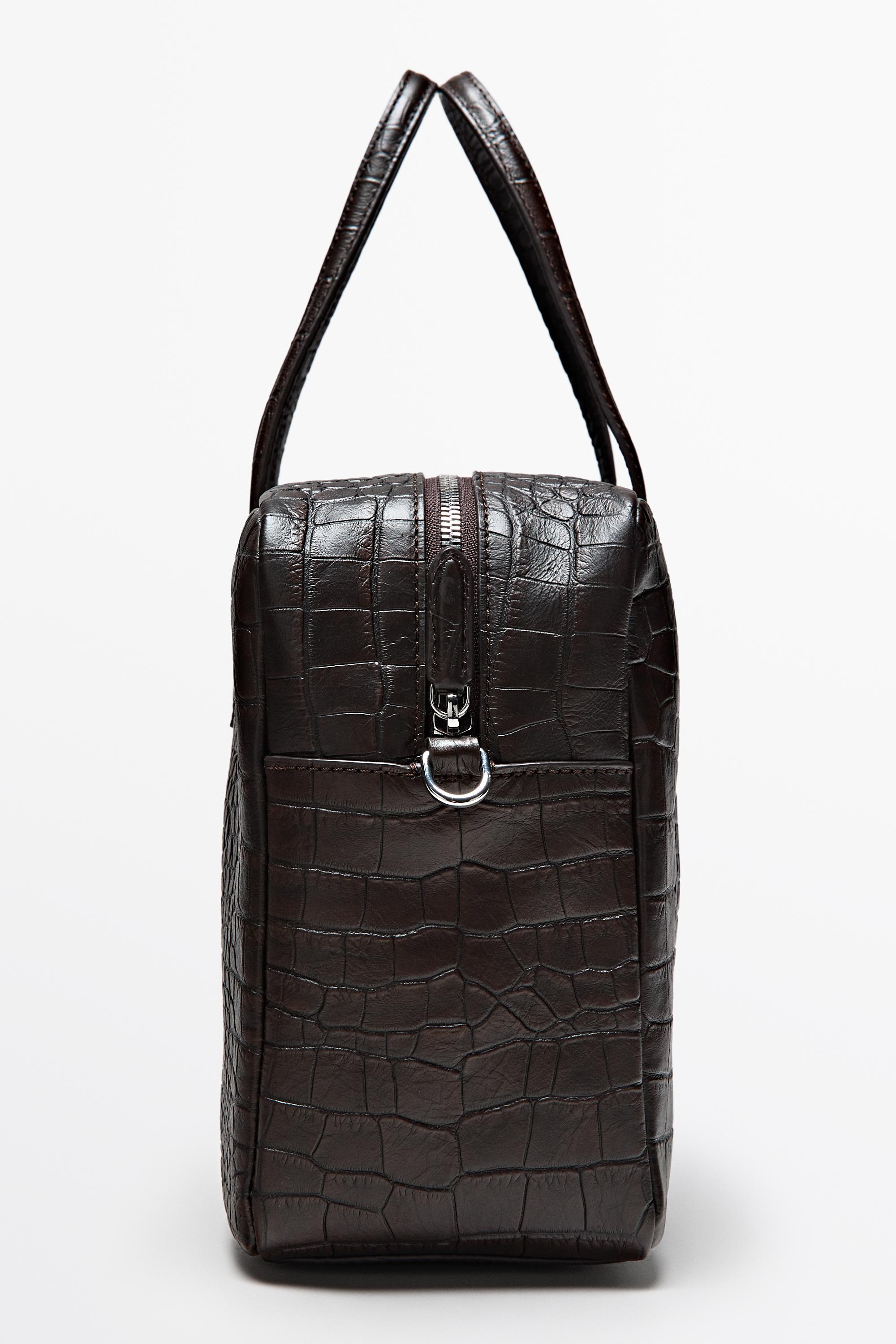 Medium leather textured duffle bag