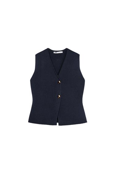 Front view of a sleeveless, dark blue waistcoat with gold buttons.
