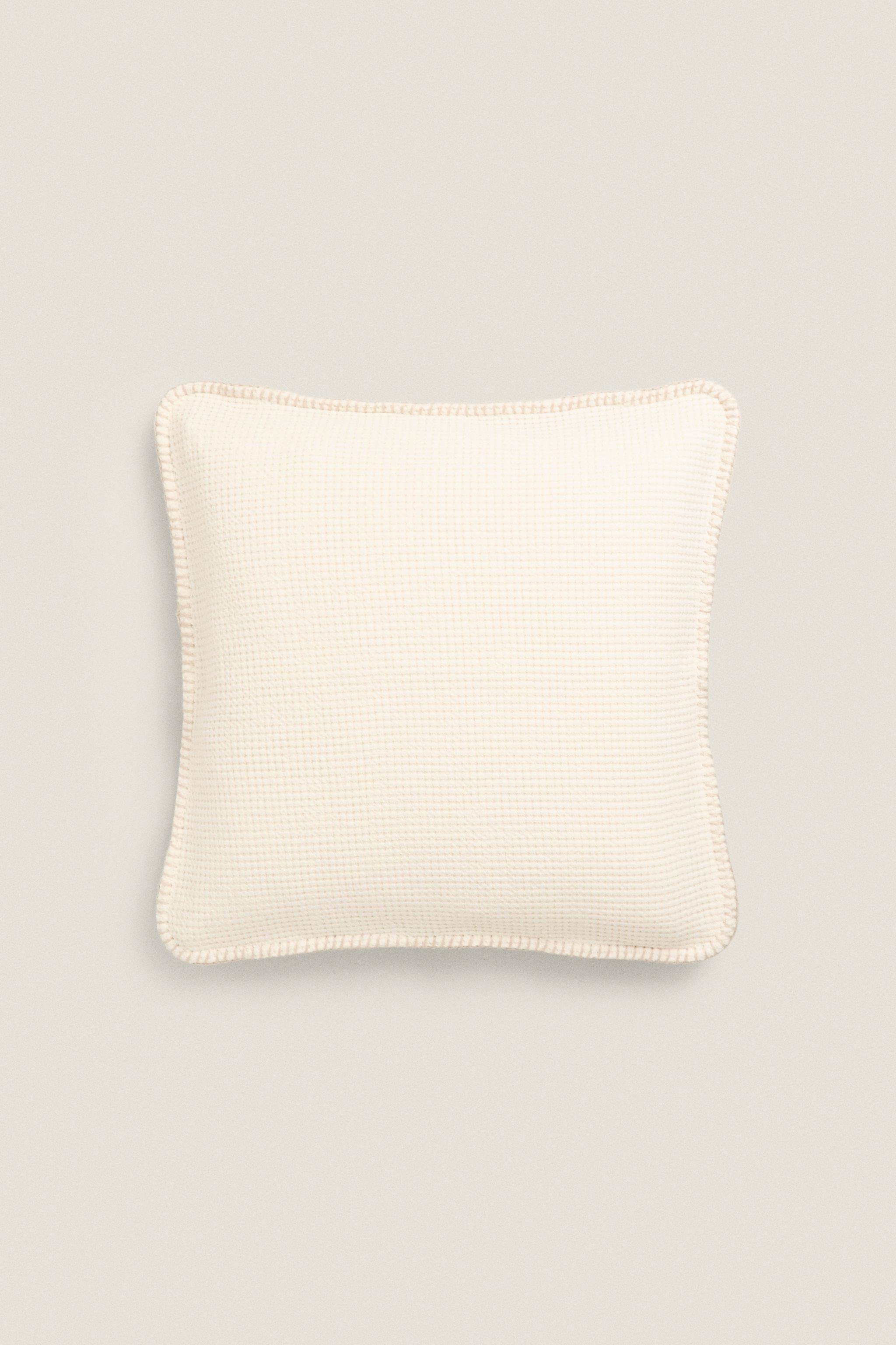 Cream knit throw clearance pillow