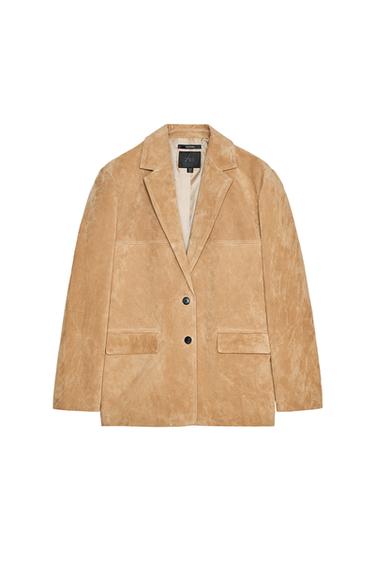 Front view of a beige jacket with lapels, two buttons, and side flap pockets.