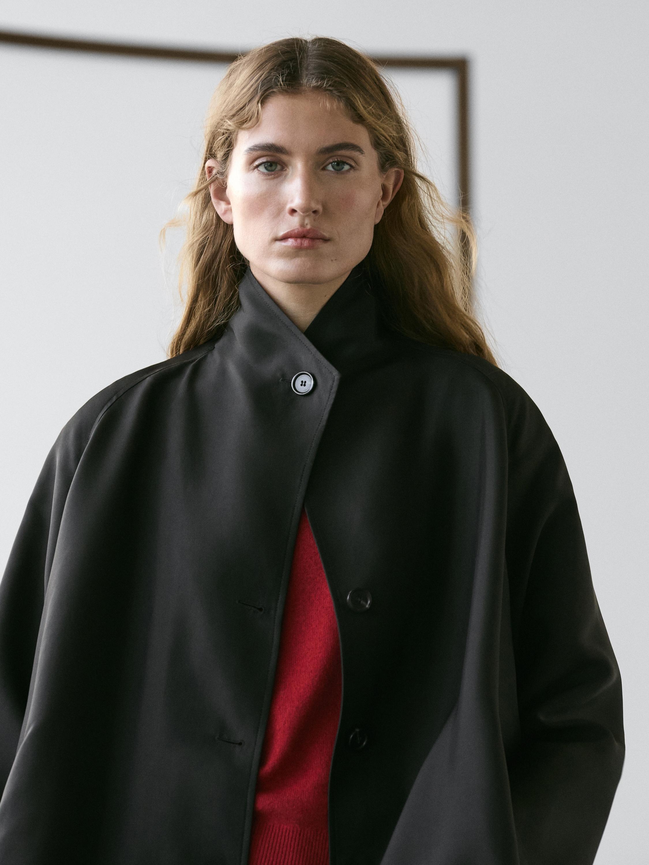 Flowing voluminous cape with button details