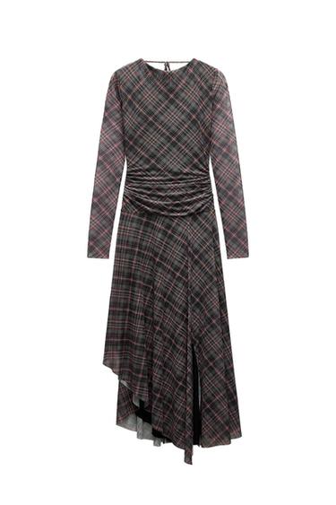 Long-sleeved dress with a checked pattern, ruched waist detail and asymmetric hem with a slit on a white background.