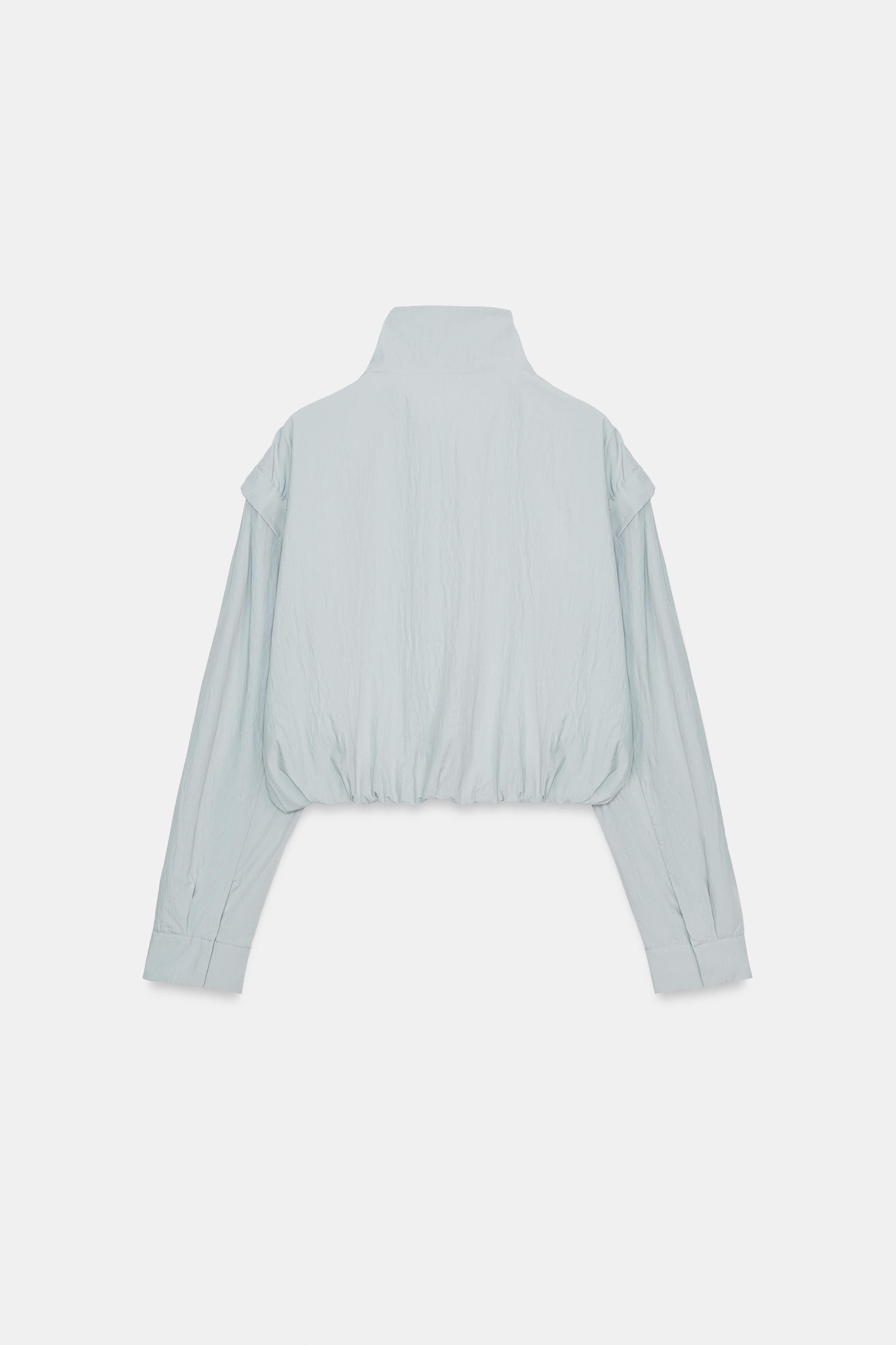 VESTE À COL MONTANT