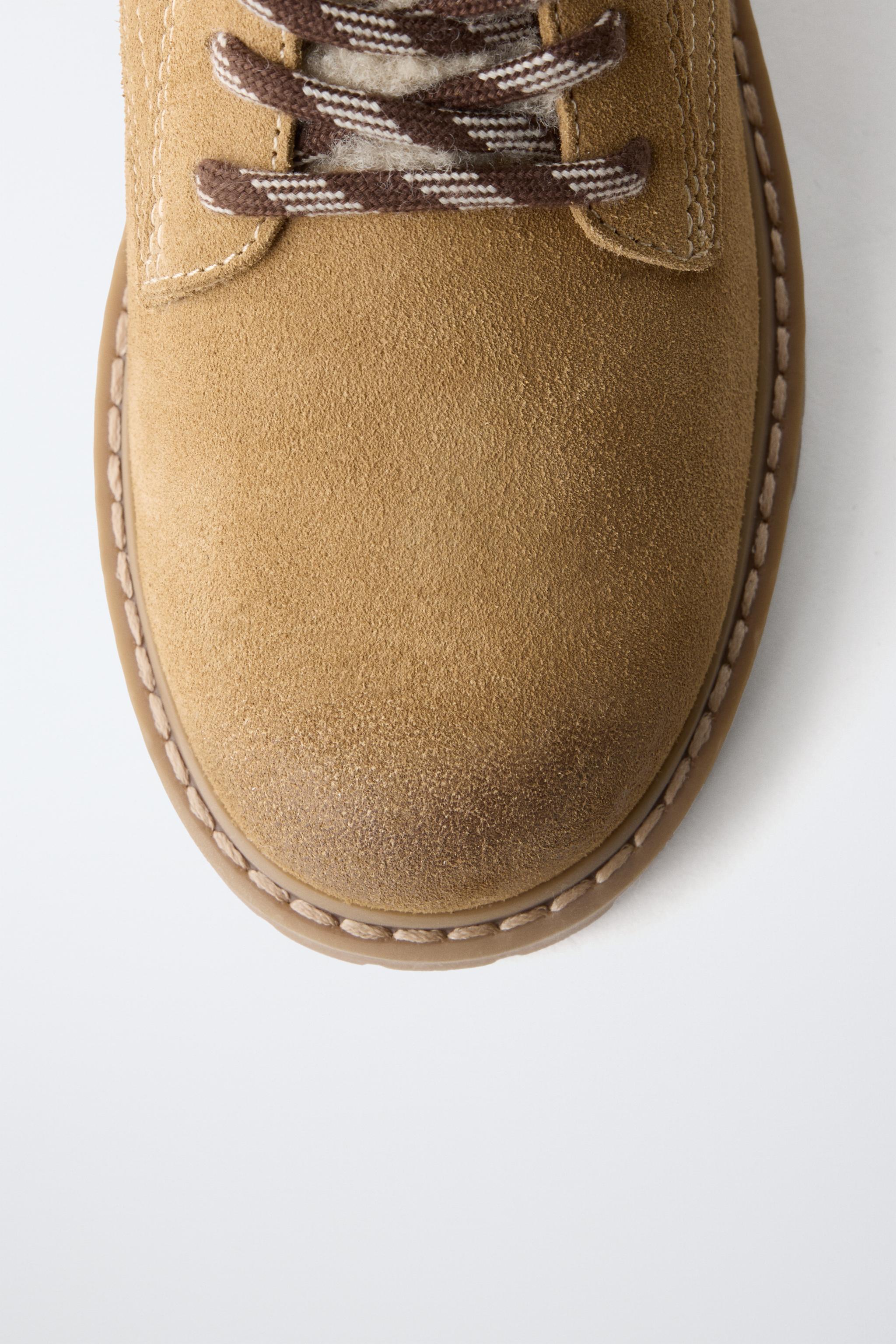 BOTTINES EN CUIR EFFET MOUTON