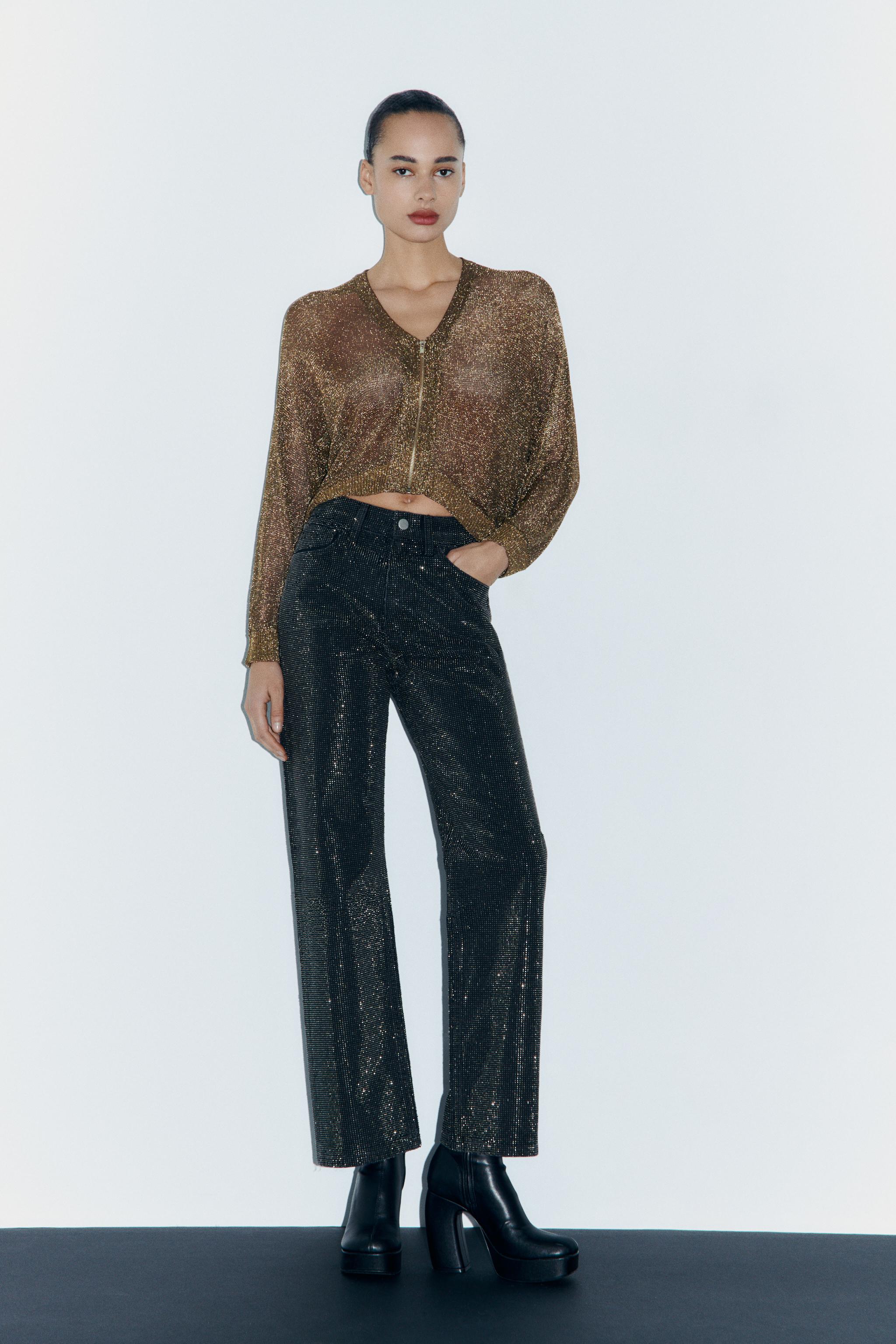 Black bolero jacket with camisole top and flared organza pants