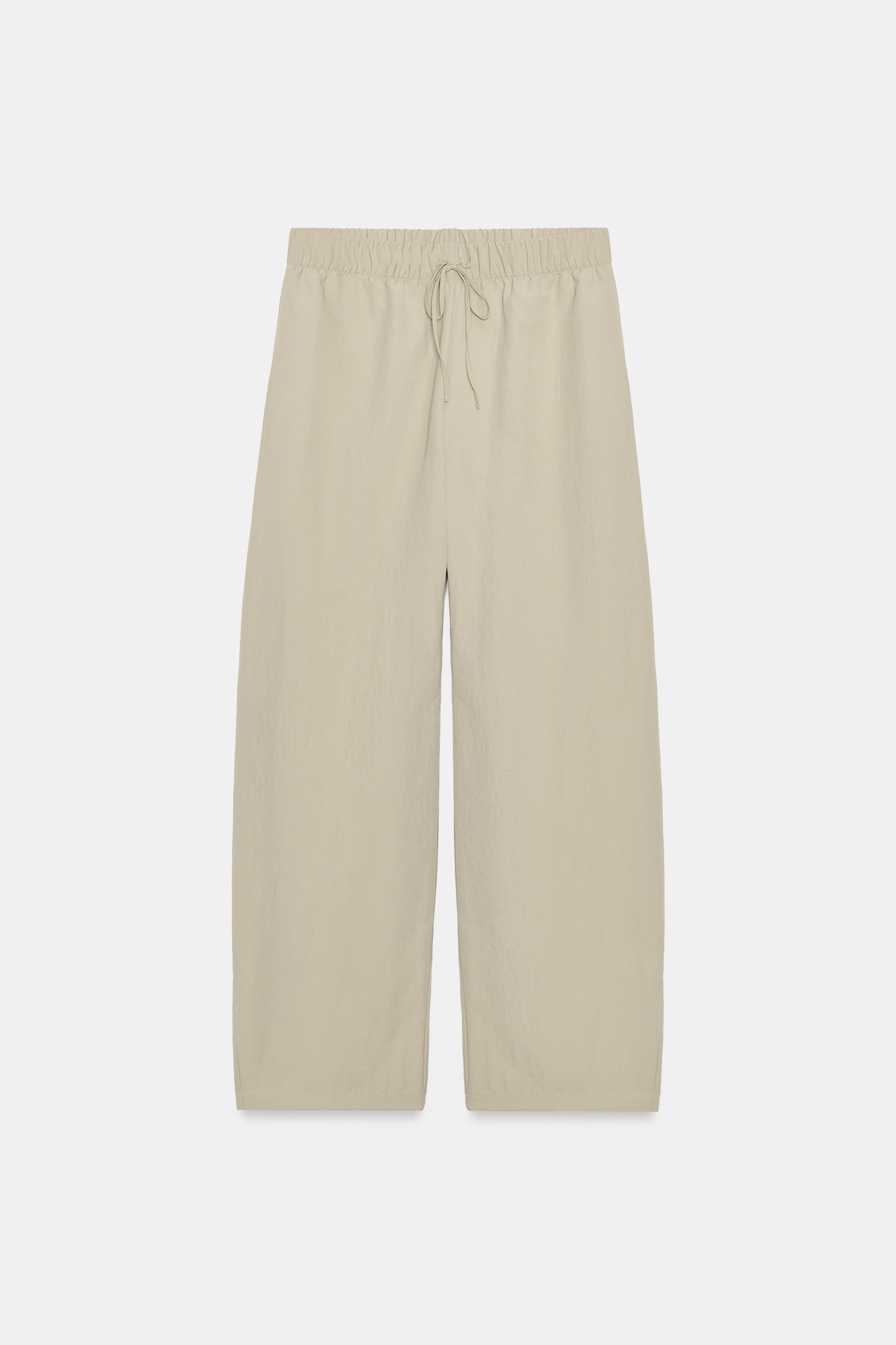 PANTALON EN TISSU TECHNIQUE ÉLASTIQUE