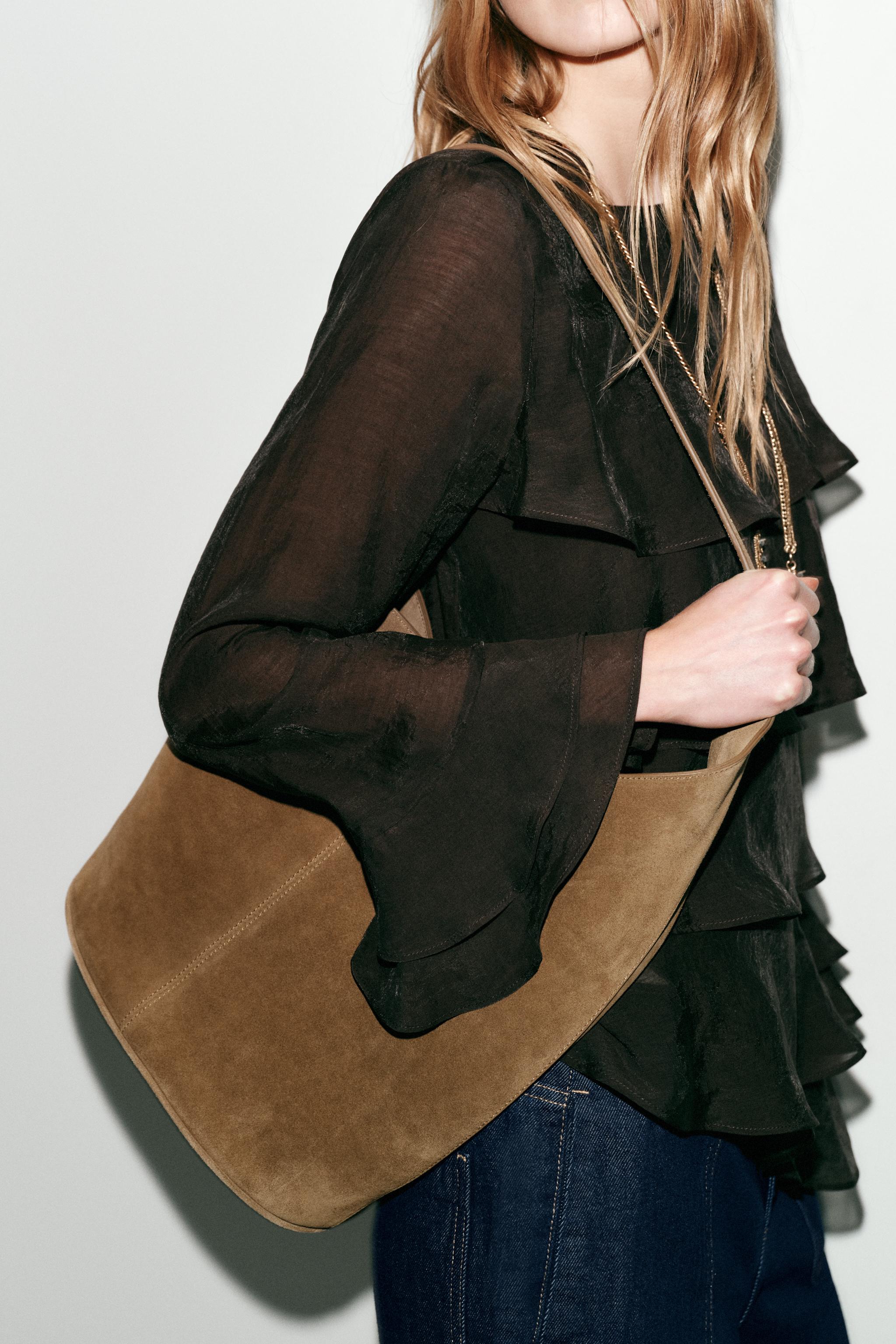 ASYMMETRIC LEATHER BUCKET BAG