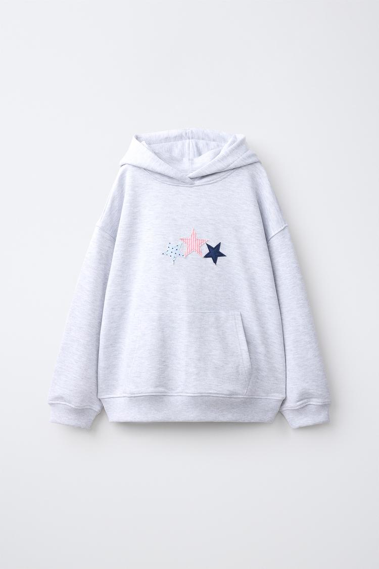 Sudadera capucha parches estrellas