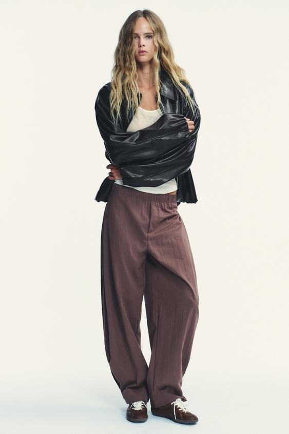 NYLON PANTS WITH BUTTON HEM
