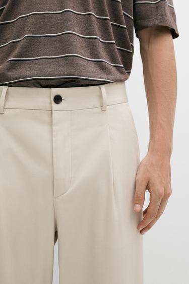Pantalon relaxed fit à pinces - Beige de Zara