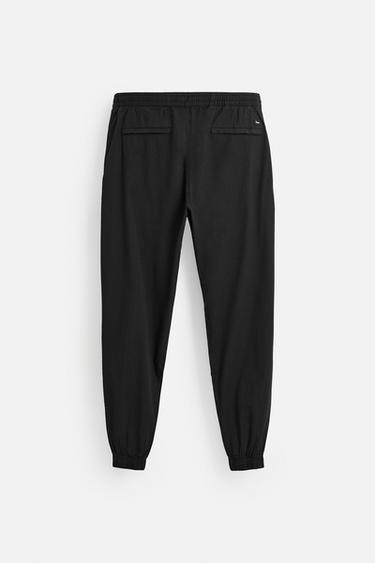 PANTALON DÉLAVÉ AVEC TAILLE JOGGING - Noir de Zara - Image 1
