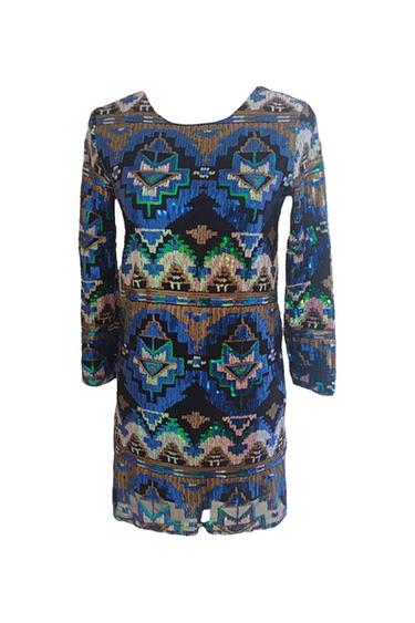 Sequin dress with geometric print in blue, green, and gold tones. Long sleeves and round neck.