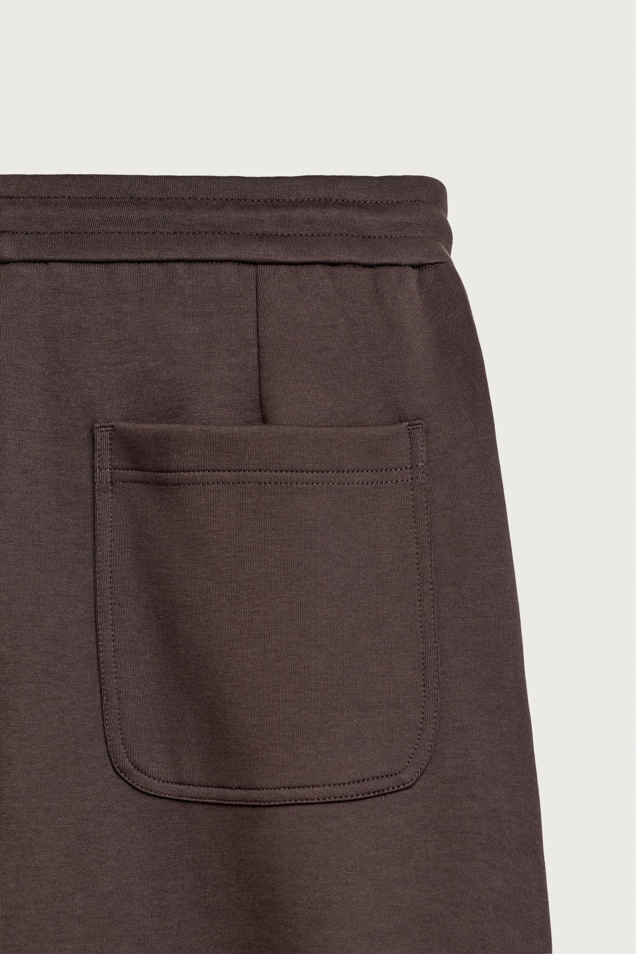 PLEATED BALLOON-FIT PANTS