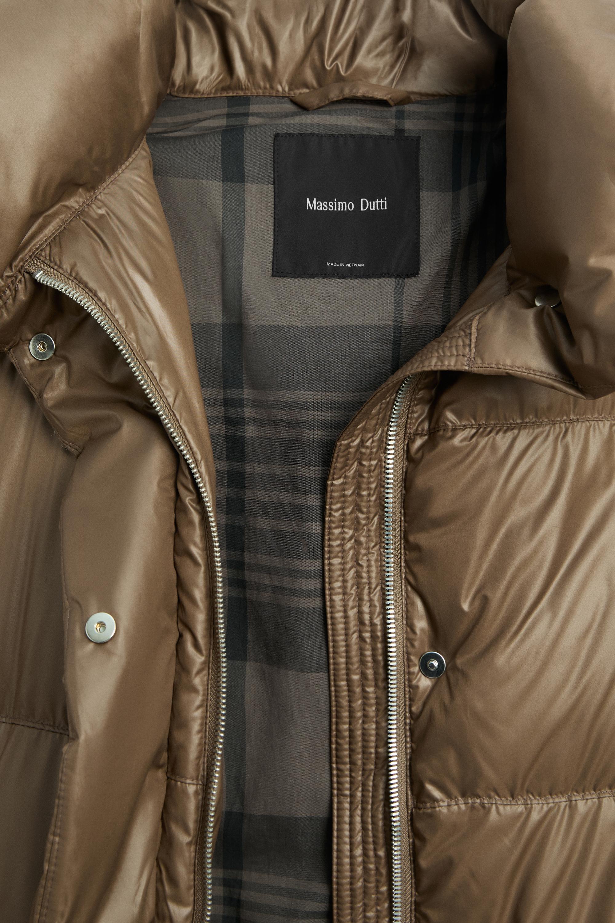 Down jacket with plaid interior detail