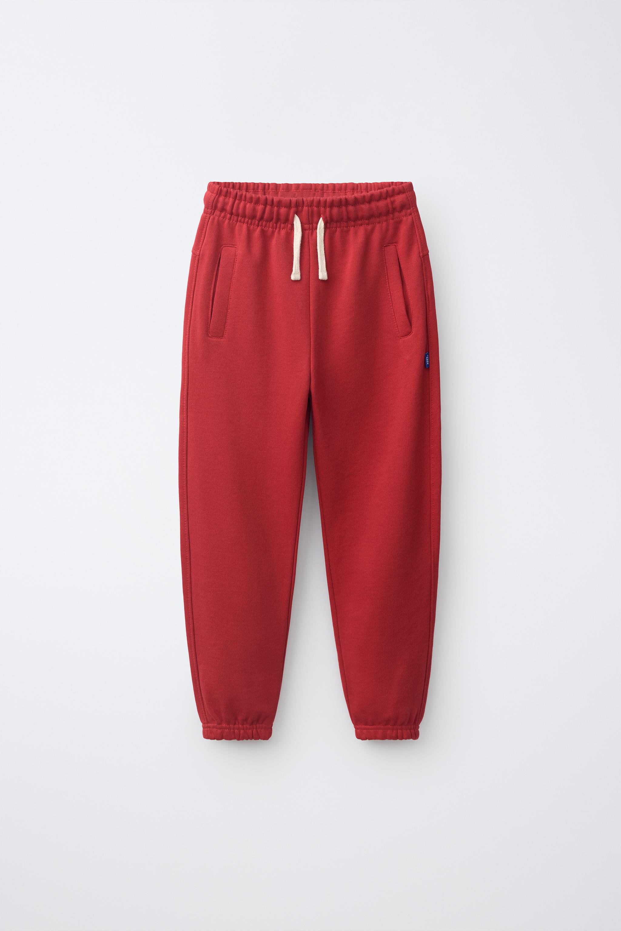 SOLID FLEECE JOGGERS WITH LABEL — Red
