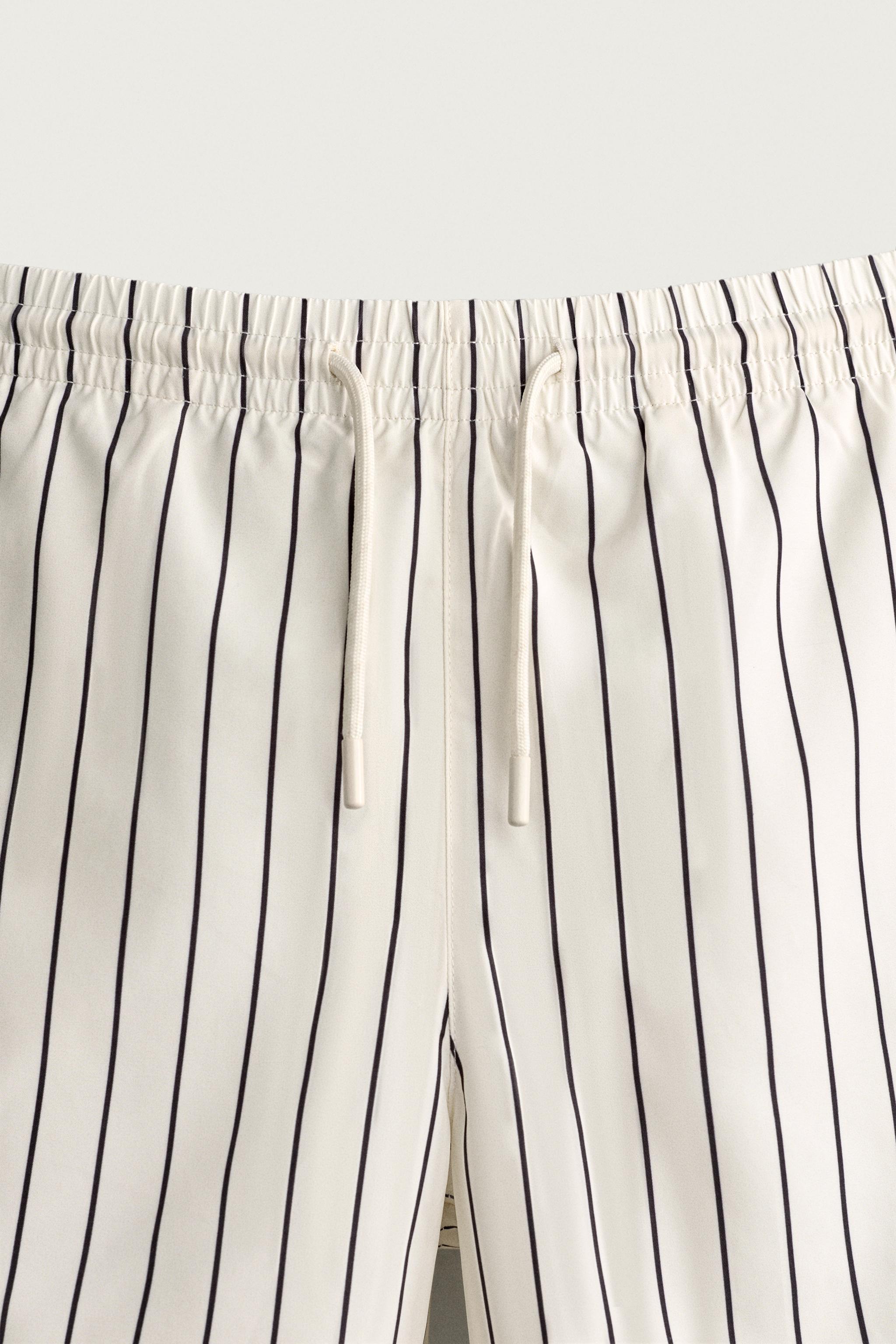 STRIPED MID-LENGTH SWIM TRUNKS