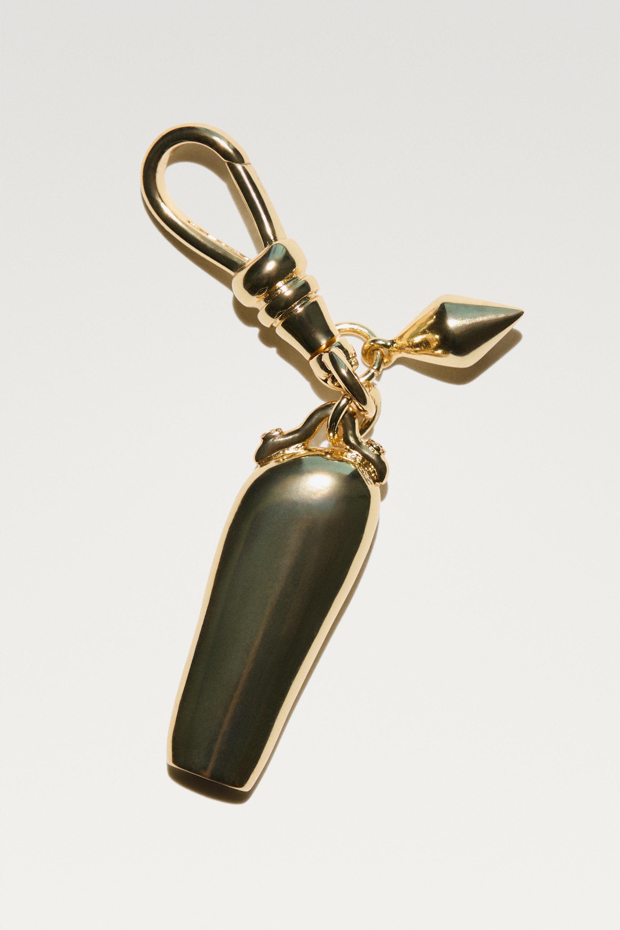 Elongated charm pendant — Golden